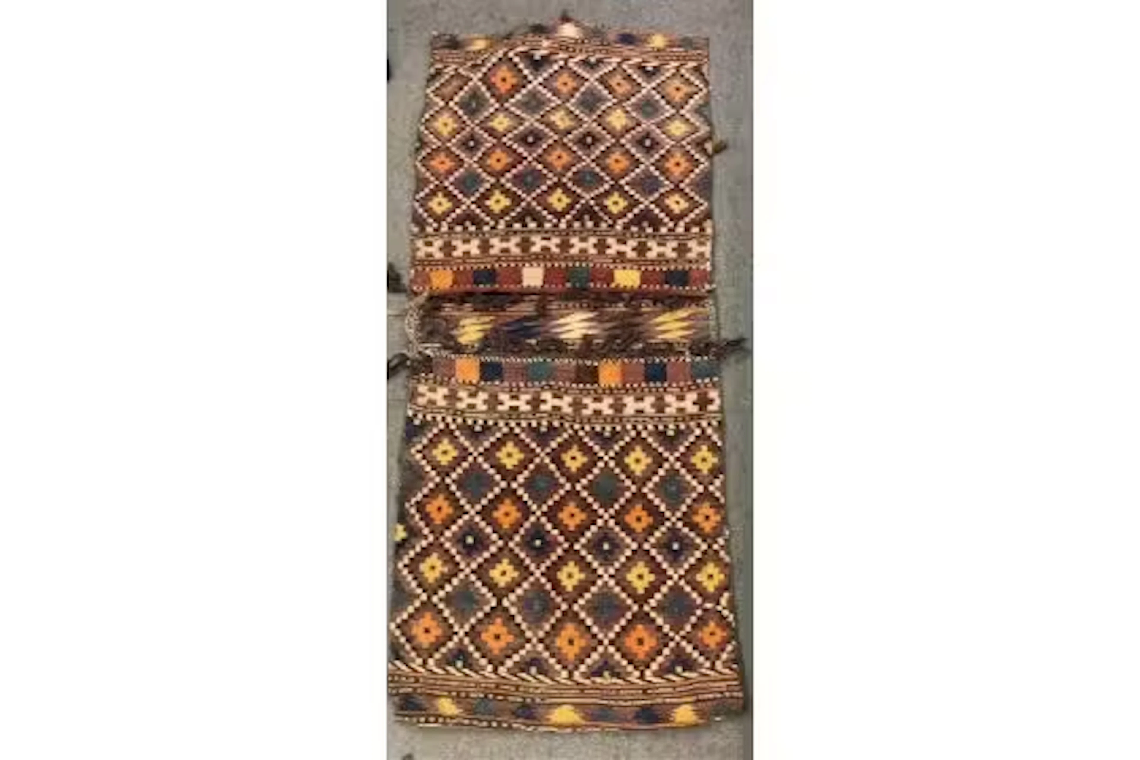 An Antique Caucasian / Afghan camel saddle bag with diamond lozenges