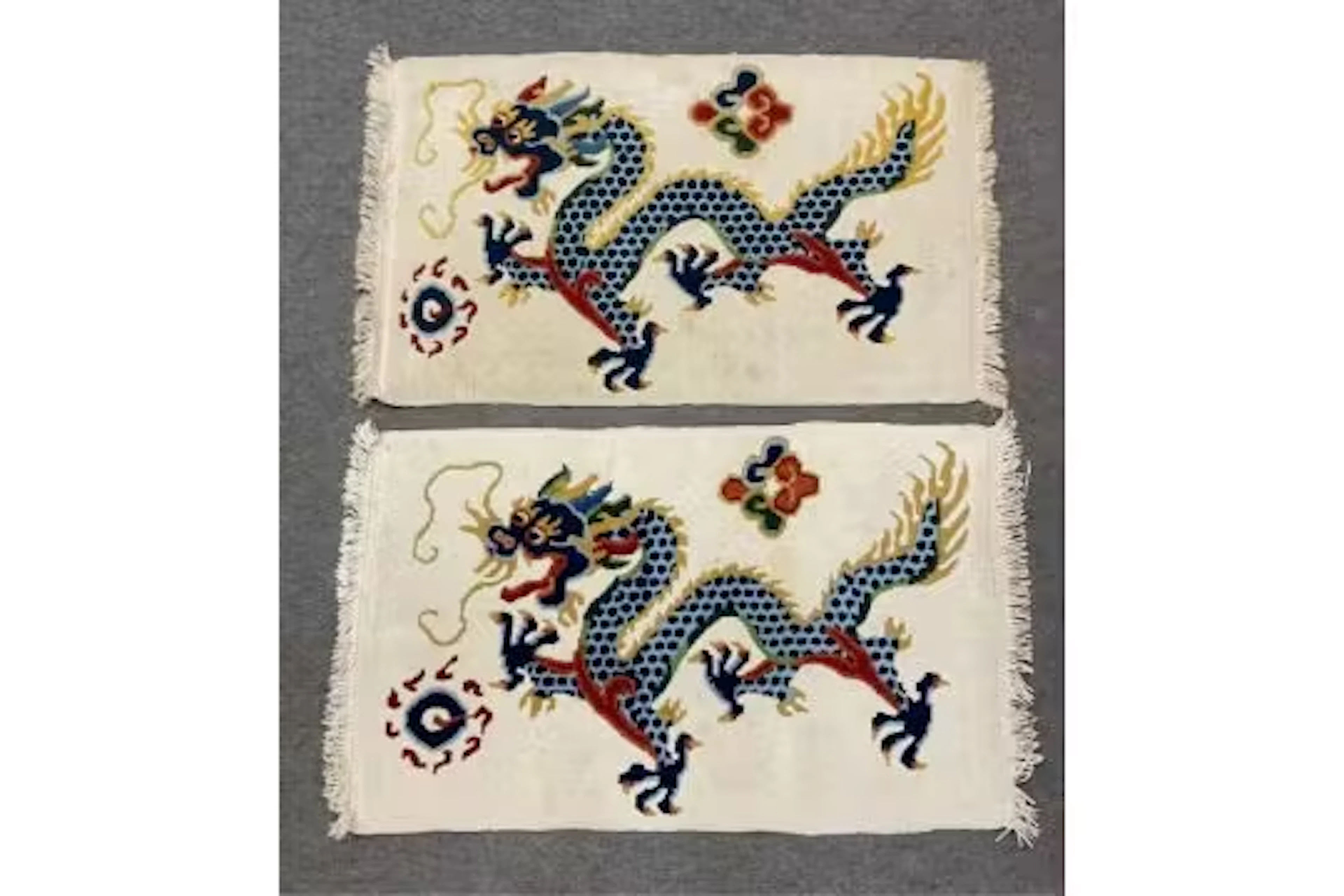 A pair of Nepal Dragon rugs, each depicting colourful four claw dragons