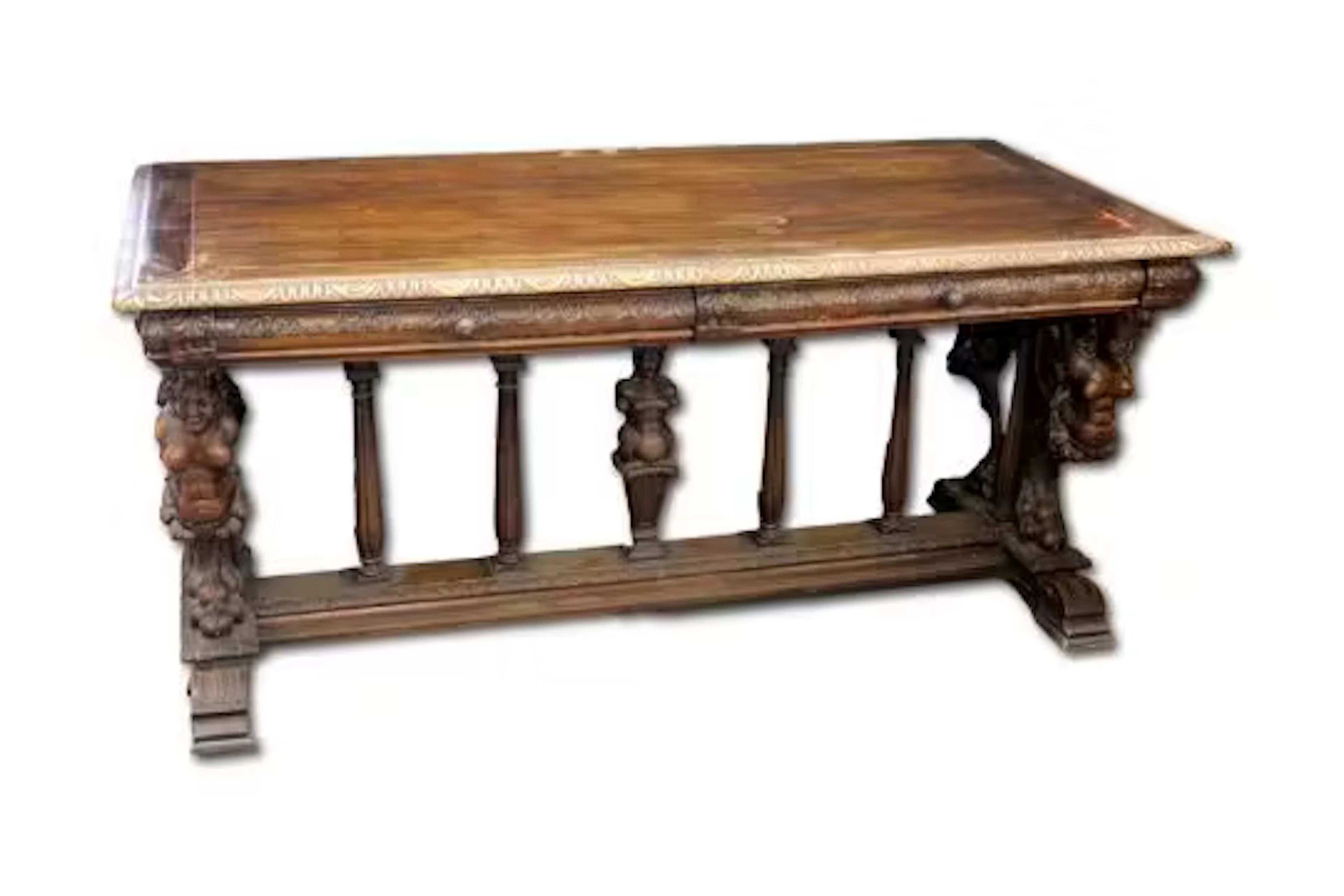 An Italian carved and stained walnut library table, in the 17th century