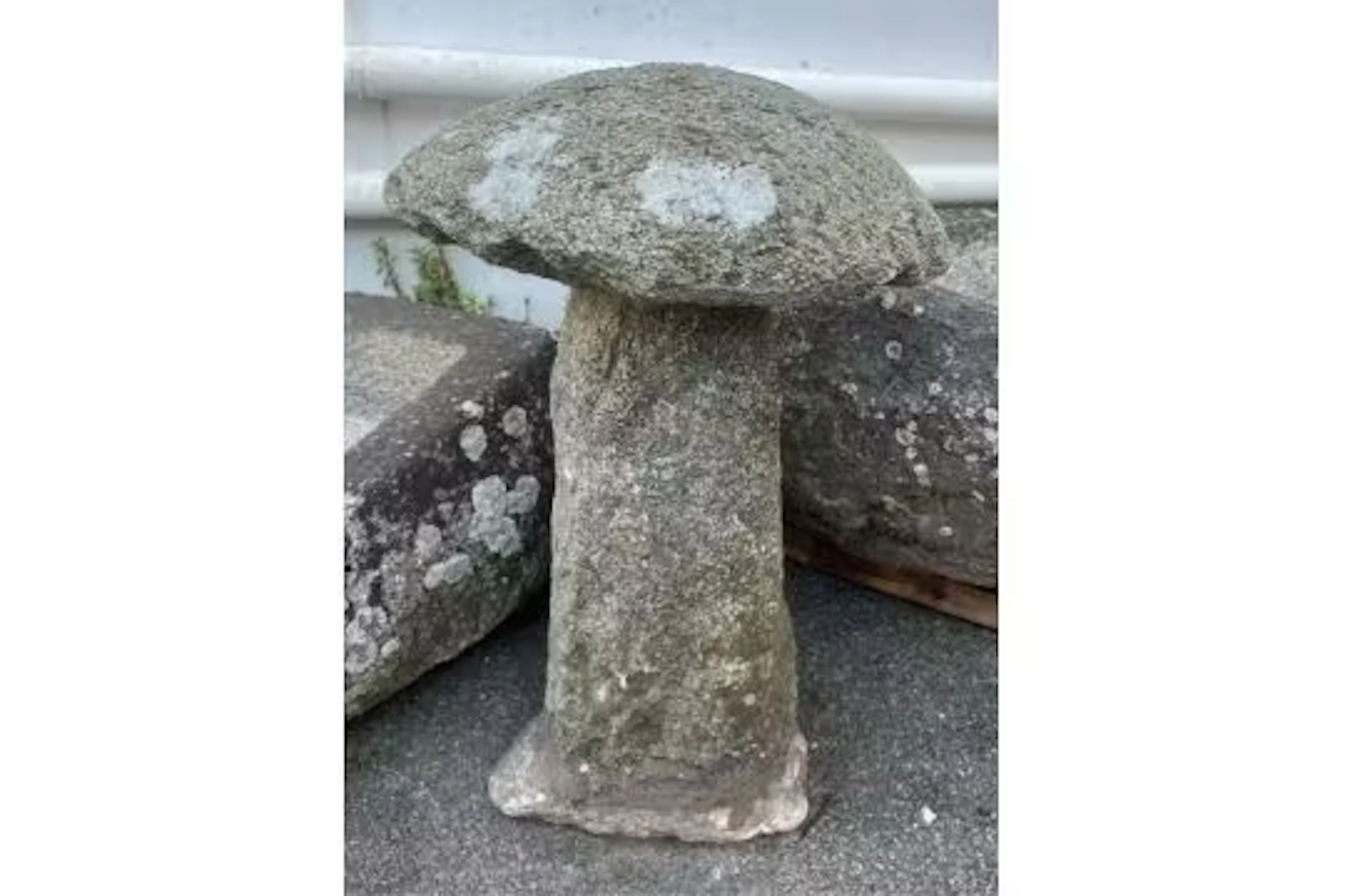 A Guernsey granite mushroom, approximately 69cm. high.
