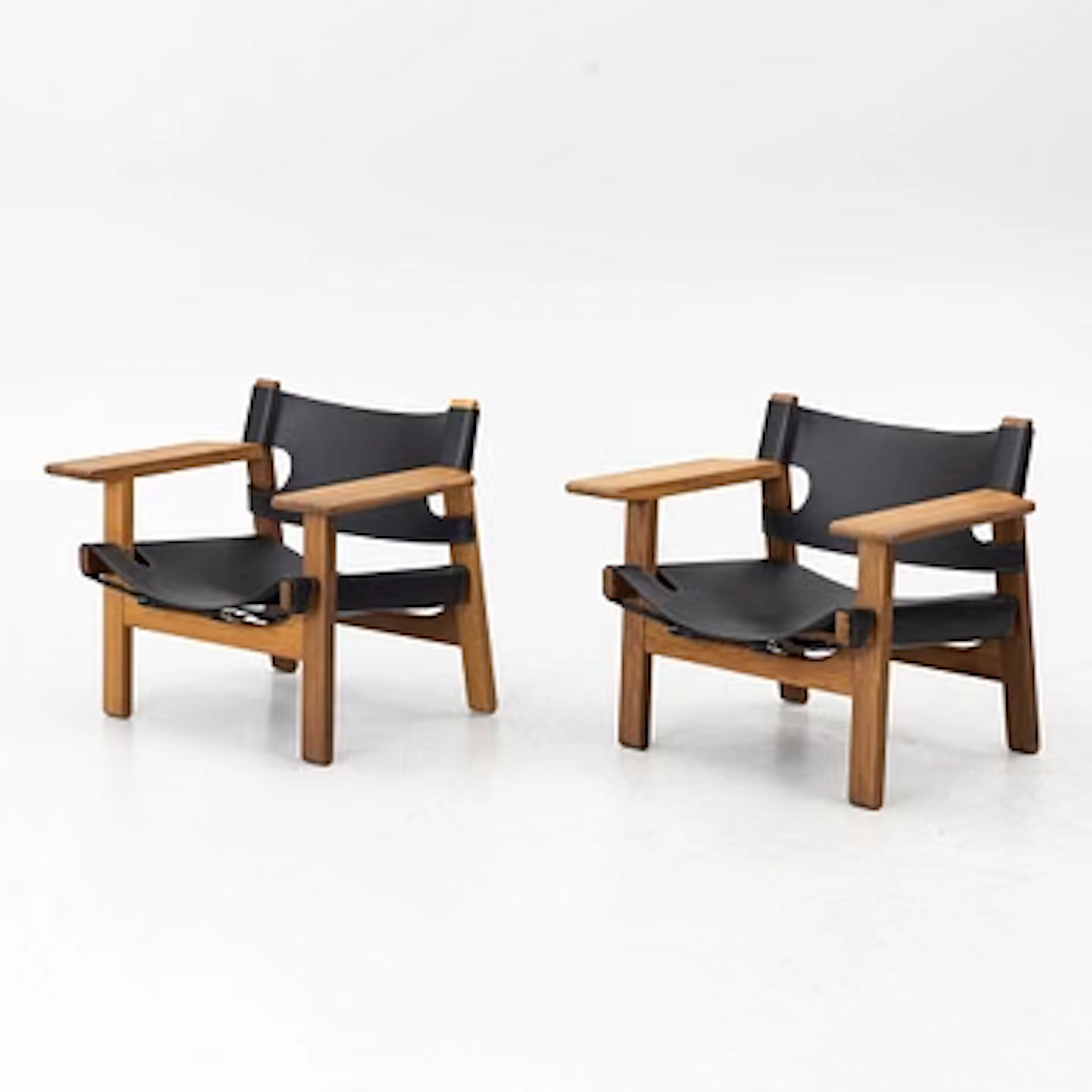 Børge Mogensen, a pair of oak and black leather "The Spanish Chair"