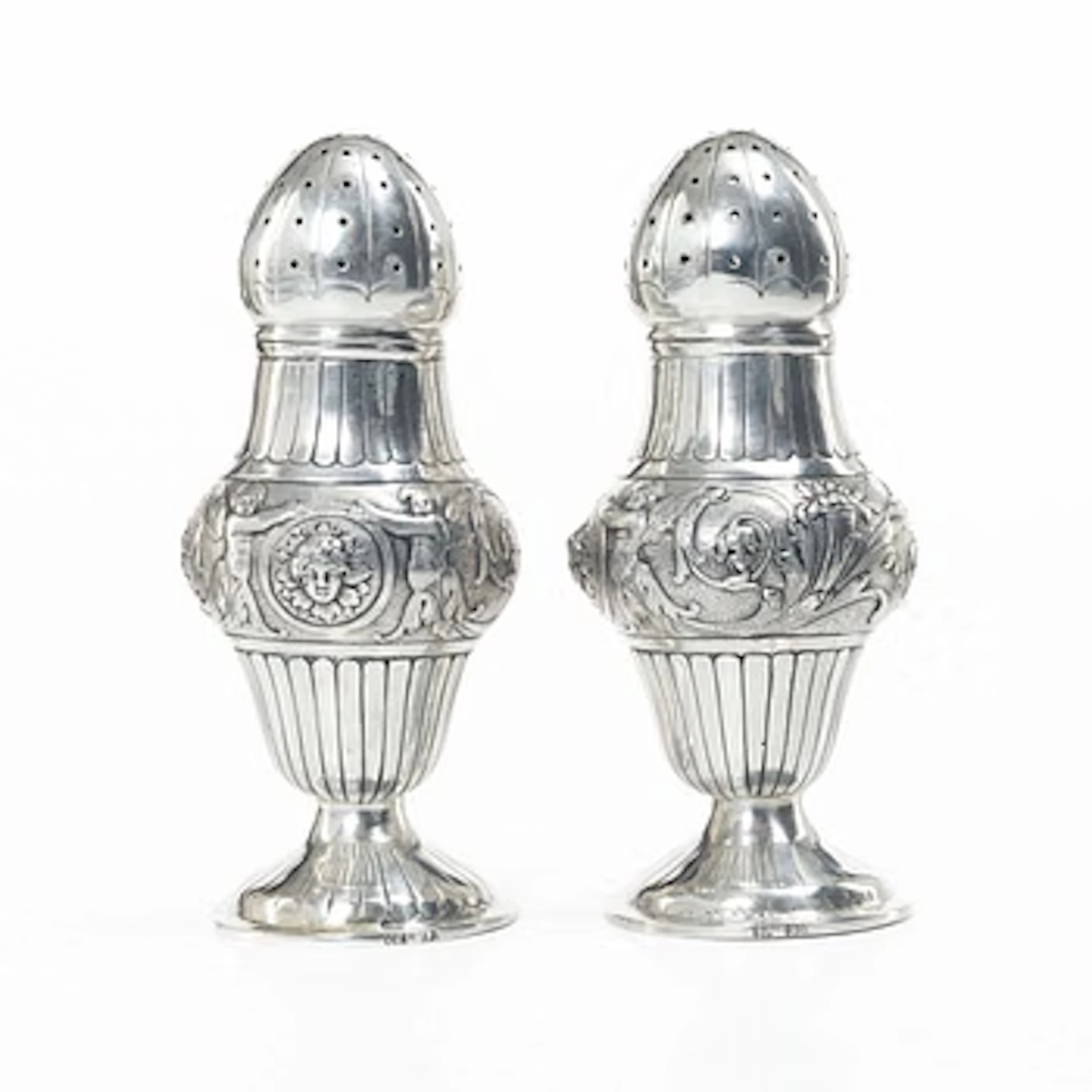 A pair of German silver sugar shakers, around 1900. Weight c. 302 grams.
