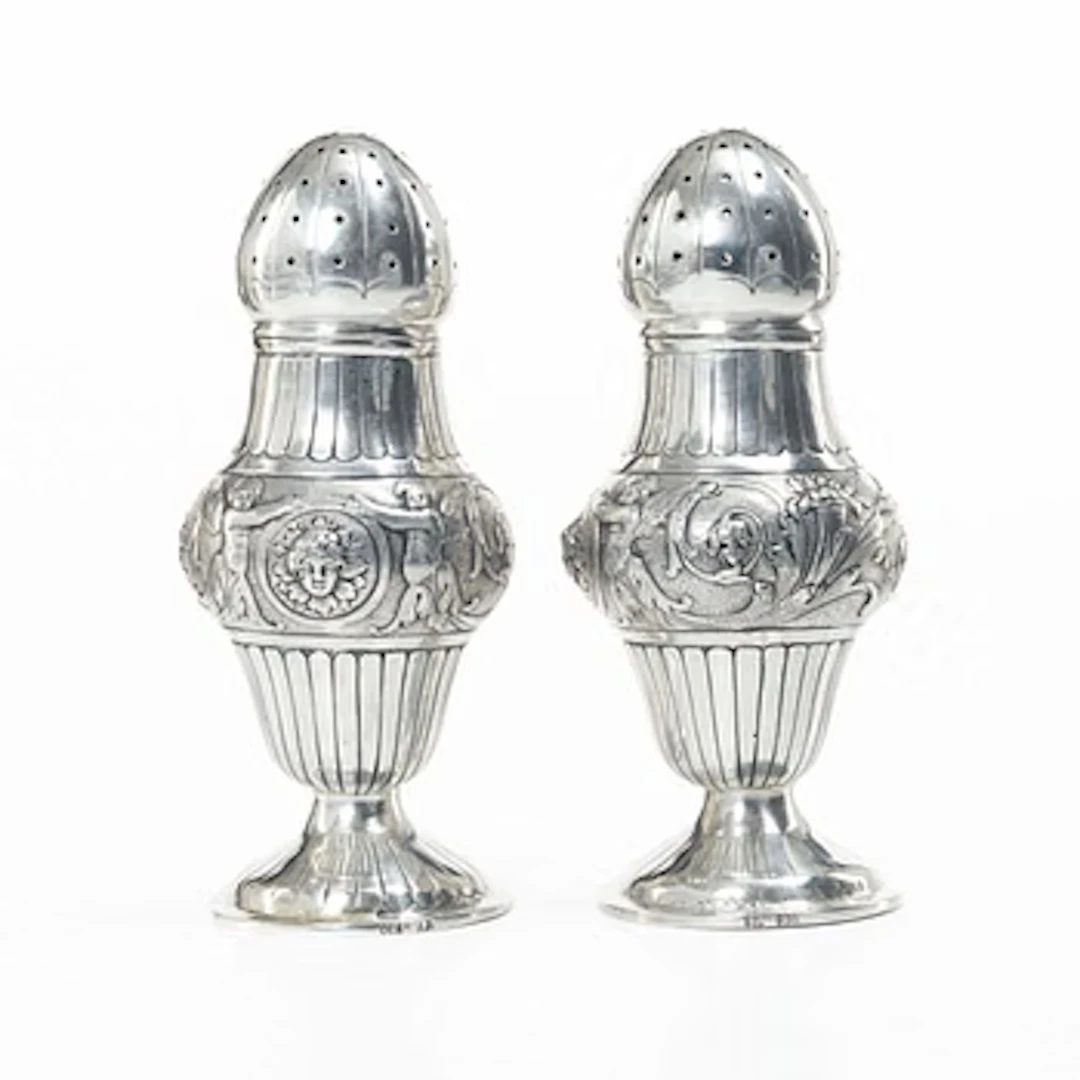A pair of German silver sugar shakers, around 1900. Weight c. 302 grams.