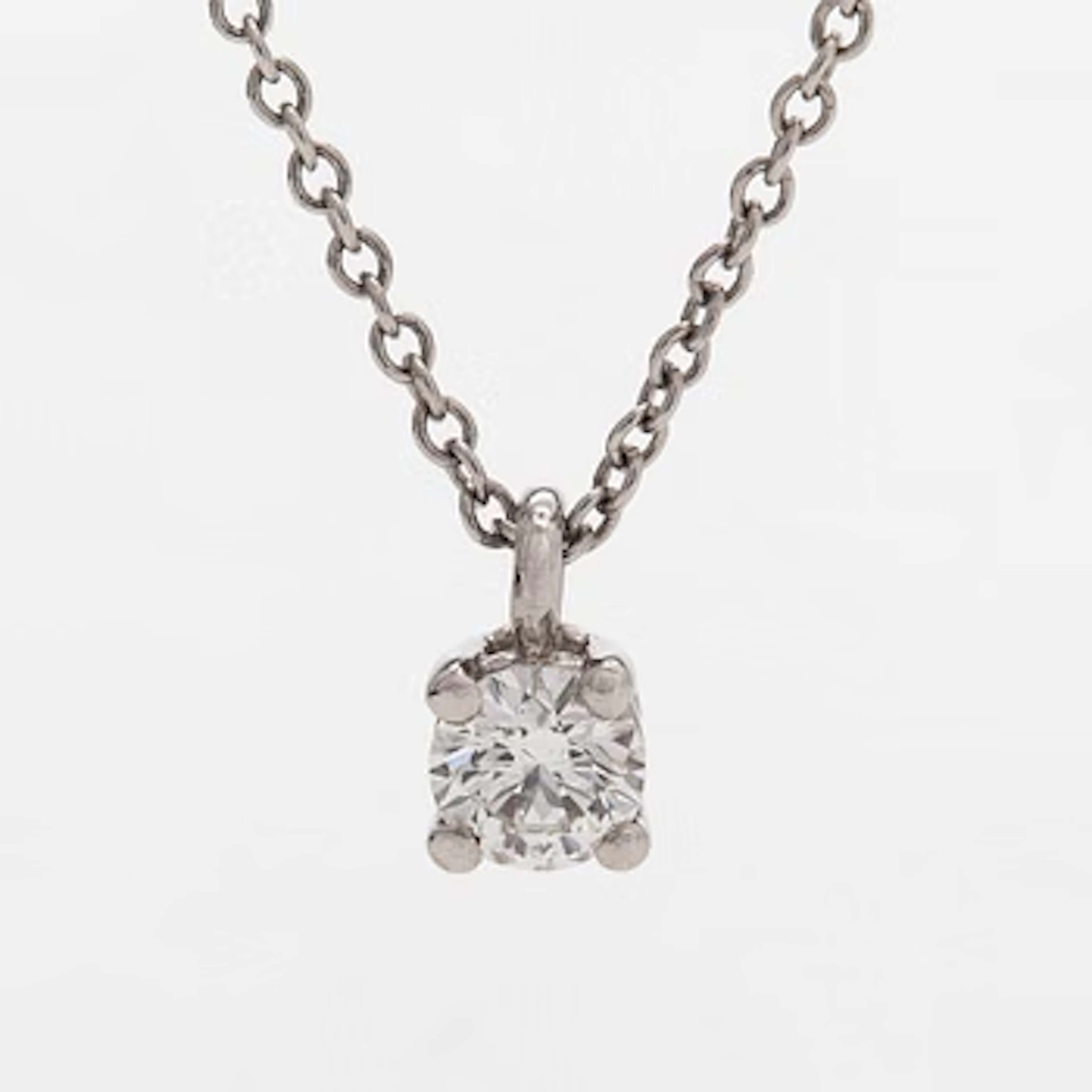Tiffany & Co, a platinum necklace with a brilliant-cut diamond.