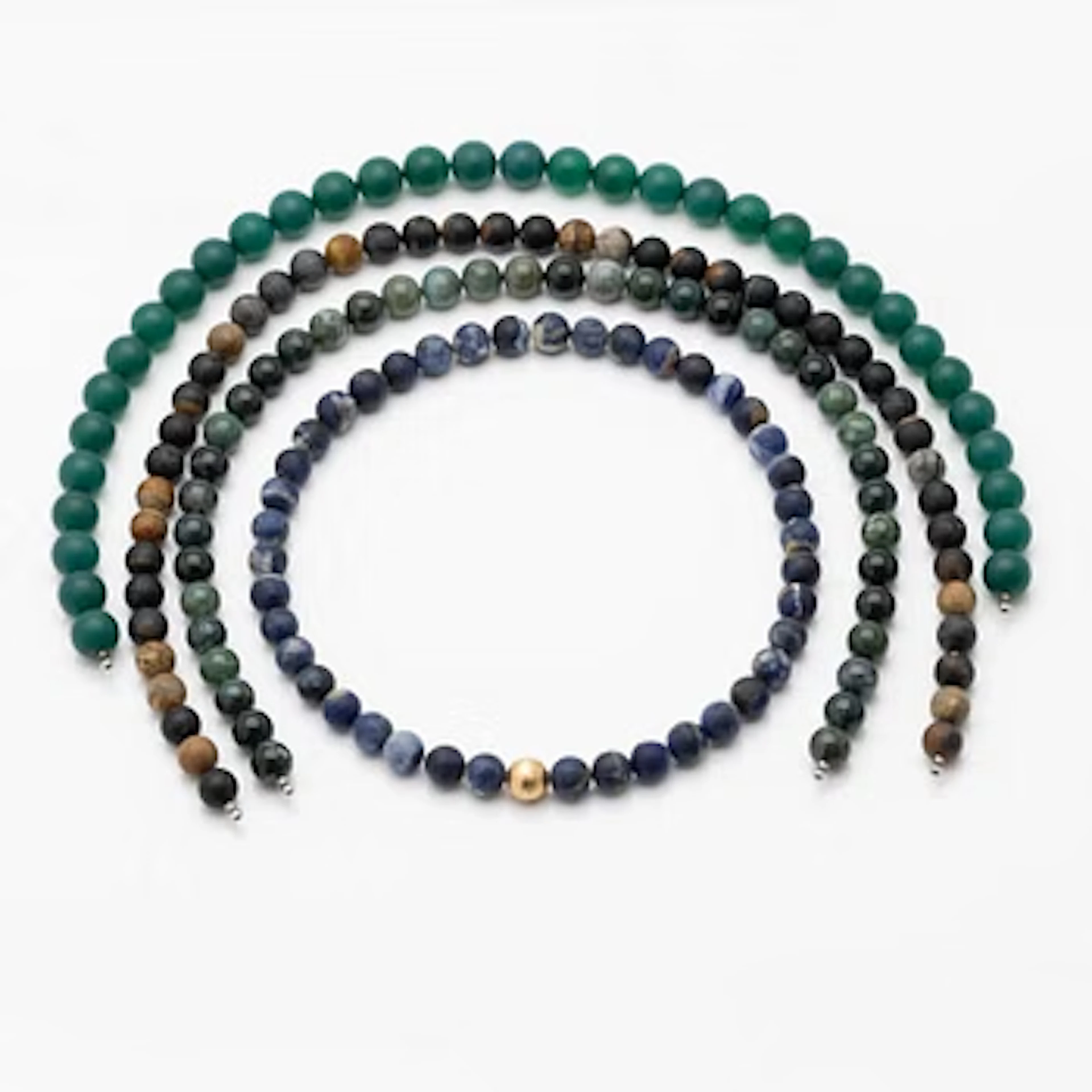Ole Lynggaard, Ball clasp in 18K gold, with four chain necklaces featuring