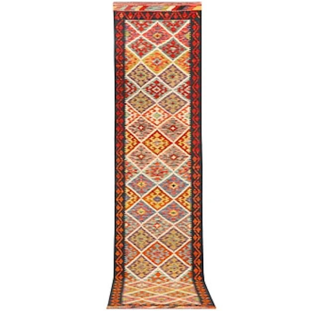 An Afghan kilim runner, c. 403 x 82 cm.