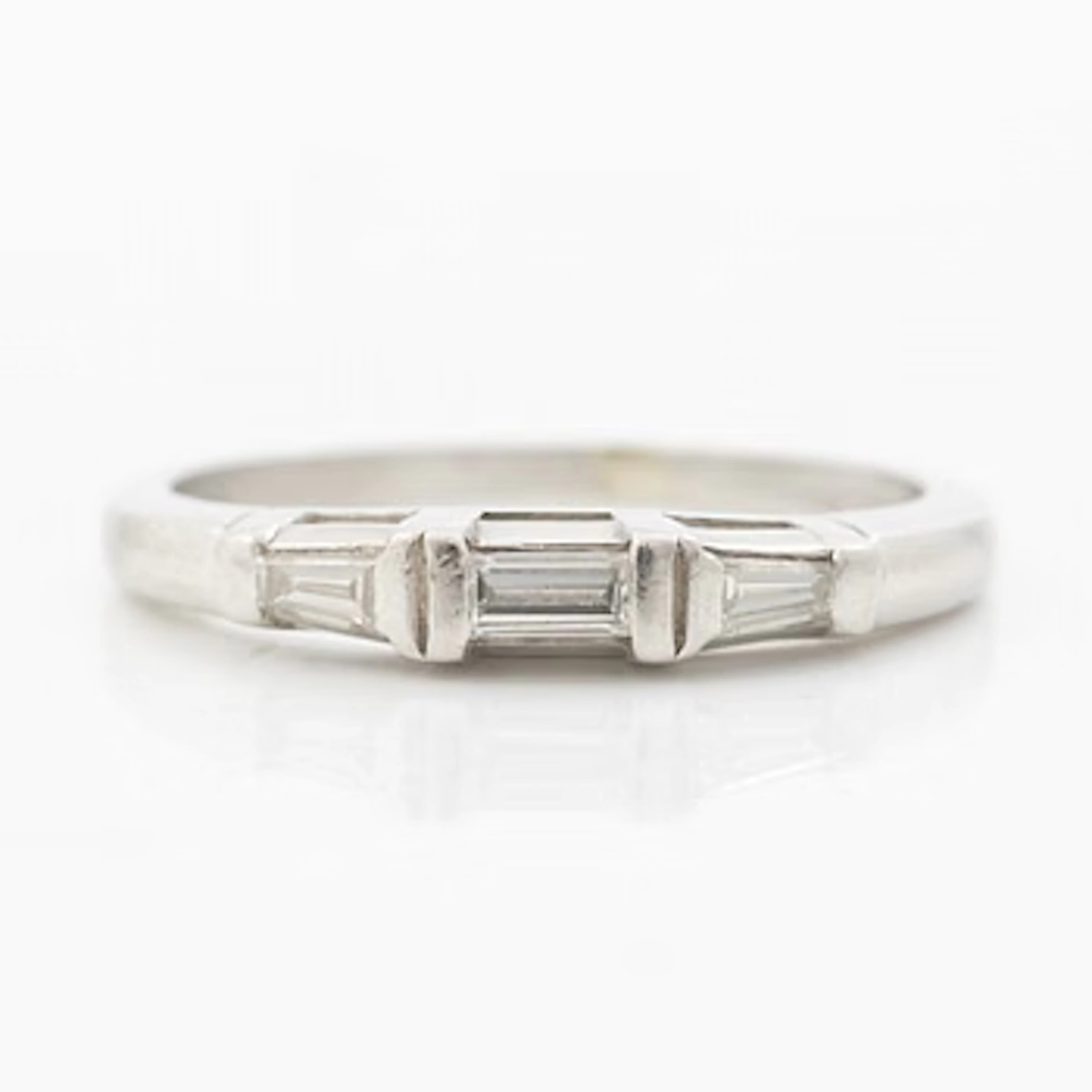 Platinum ring with baguette-cut diamonds.