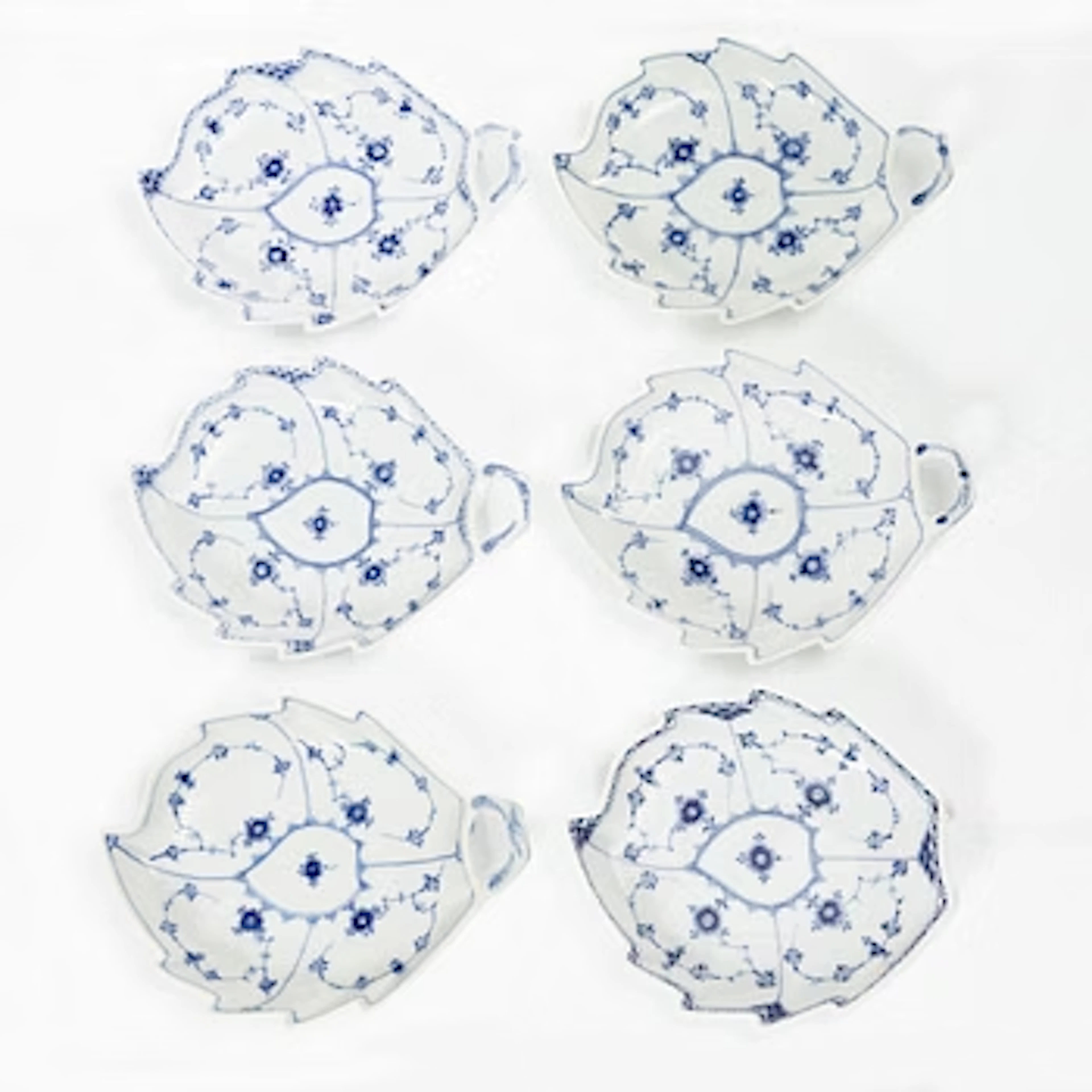 Royal Copenhagen, Six Leaf-shaped 'Musselmalet' dishes, Denmark, 20th century.