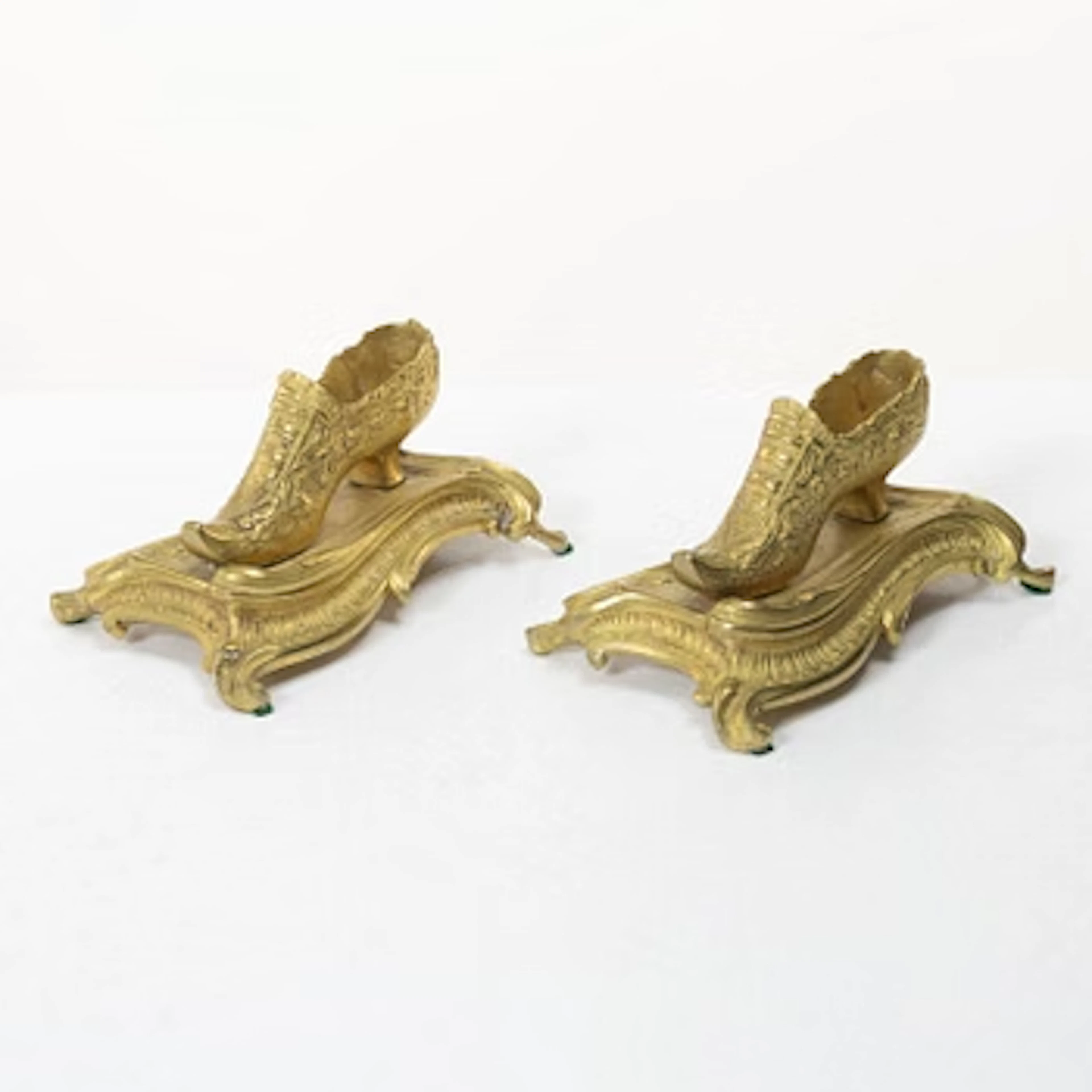 Table ornaments in the form of shoes, a pair, fire-gilt bronze, probably