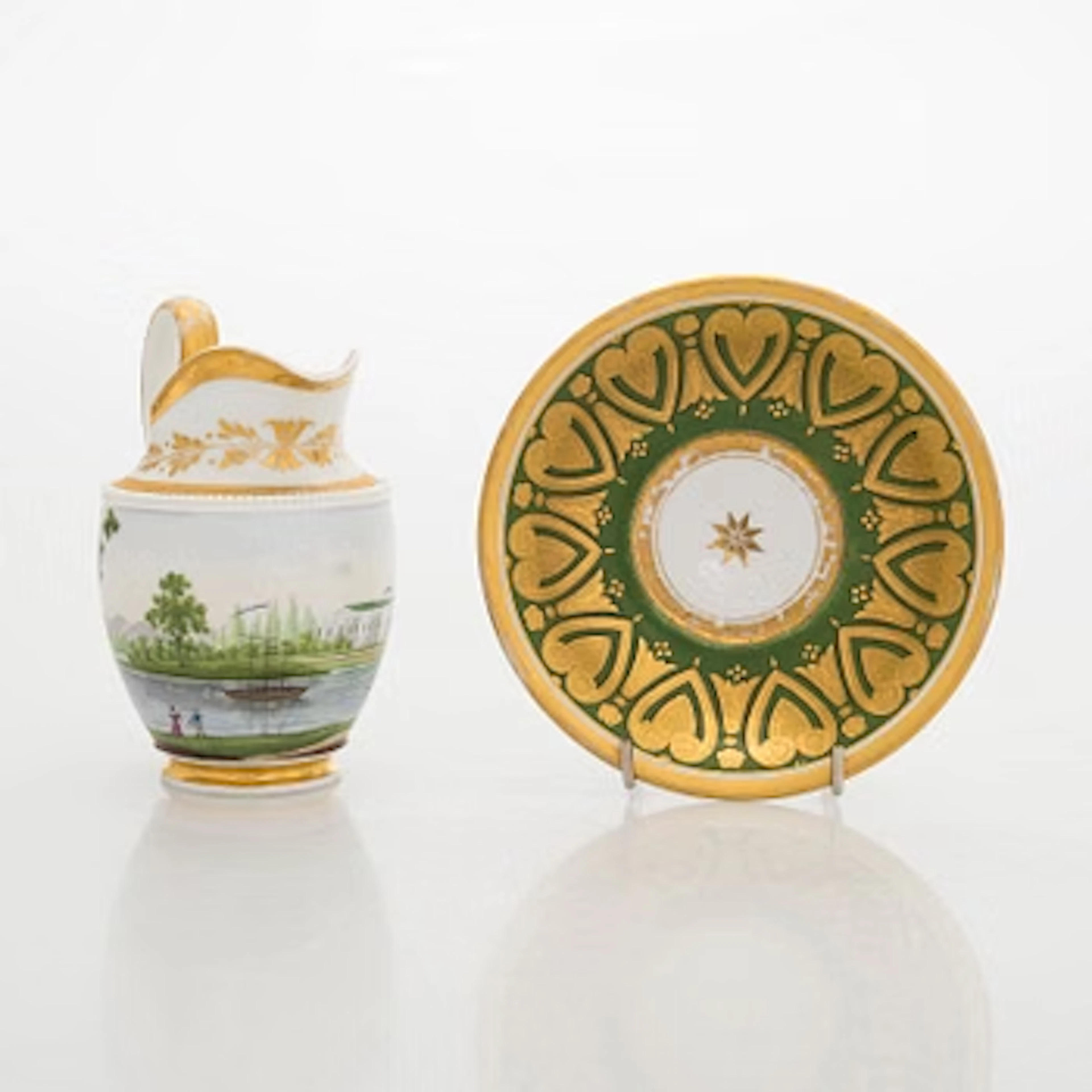 A porcelain milk jug, Gardner, and a saucer, Russia first half of