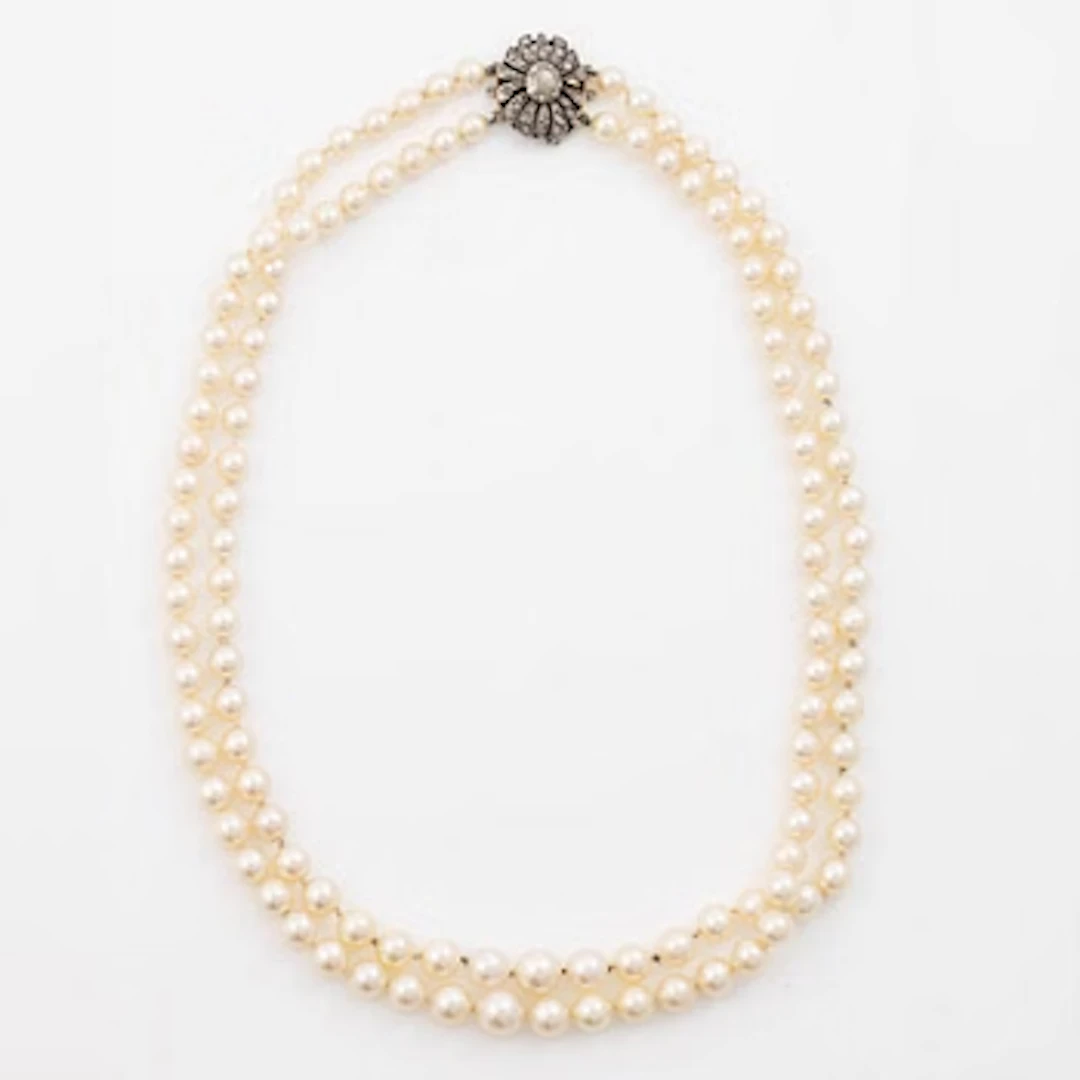 Two-row cultured pearl necklace with a silver and 18K gold clasp set