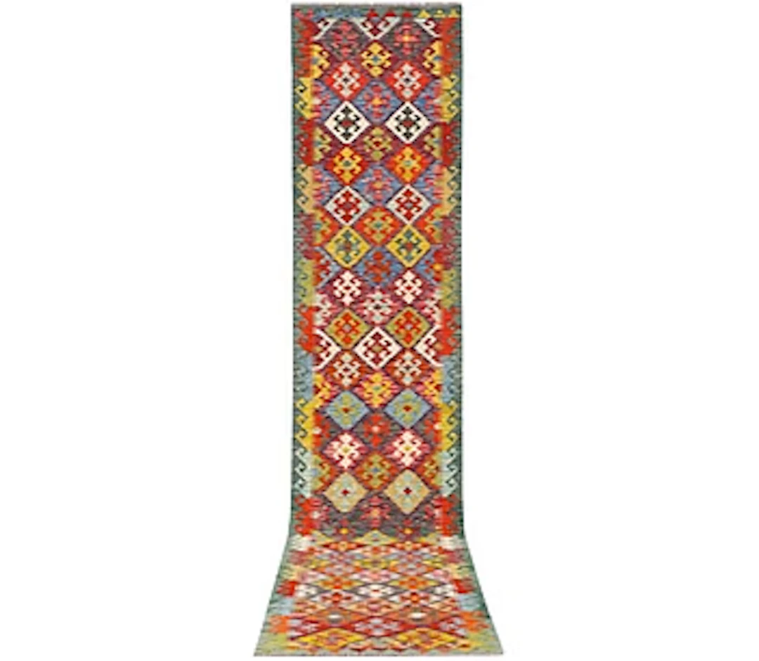 An Afghan kilim runner, c. 507 x 85 cm.