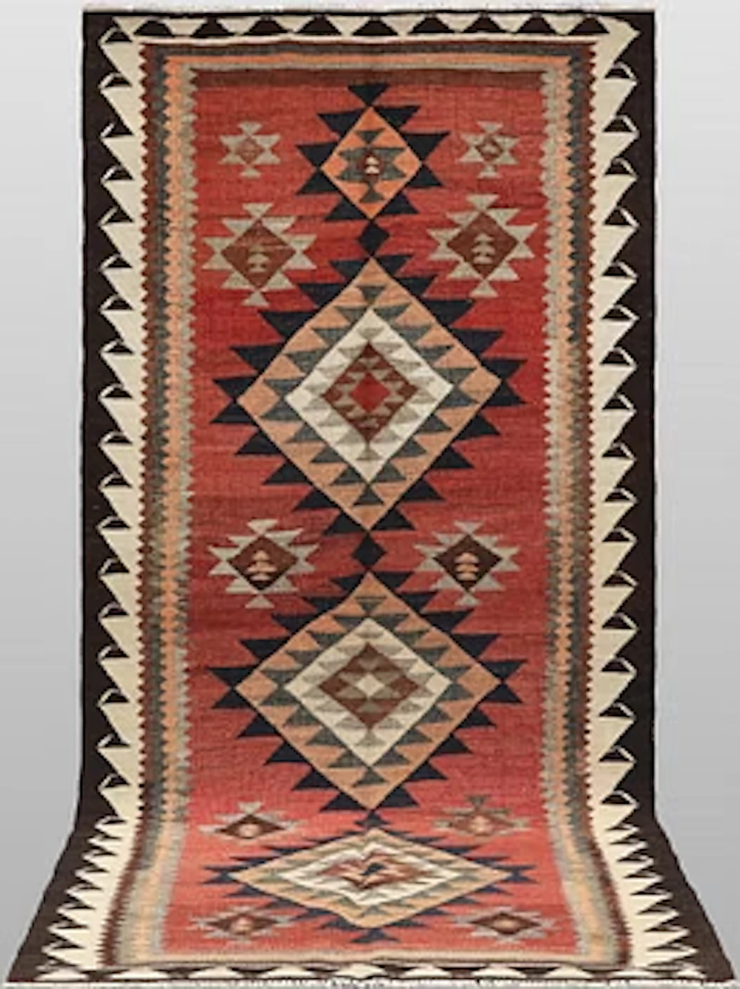 A Nomad Kurdish kilim rug, 270 x 132 cm.