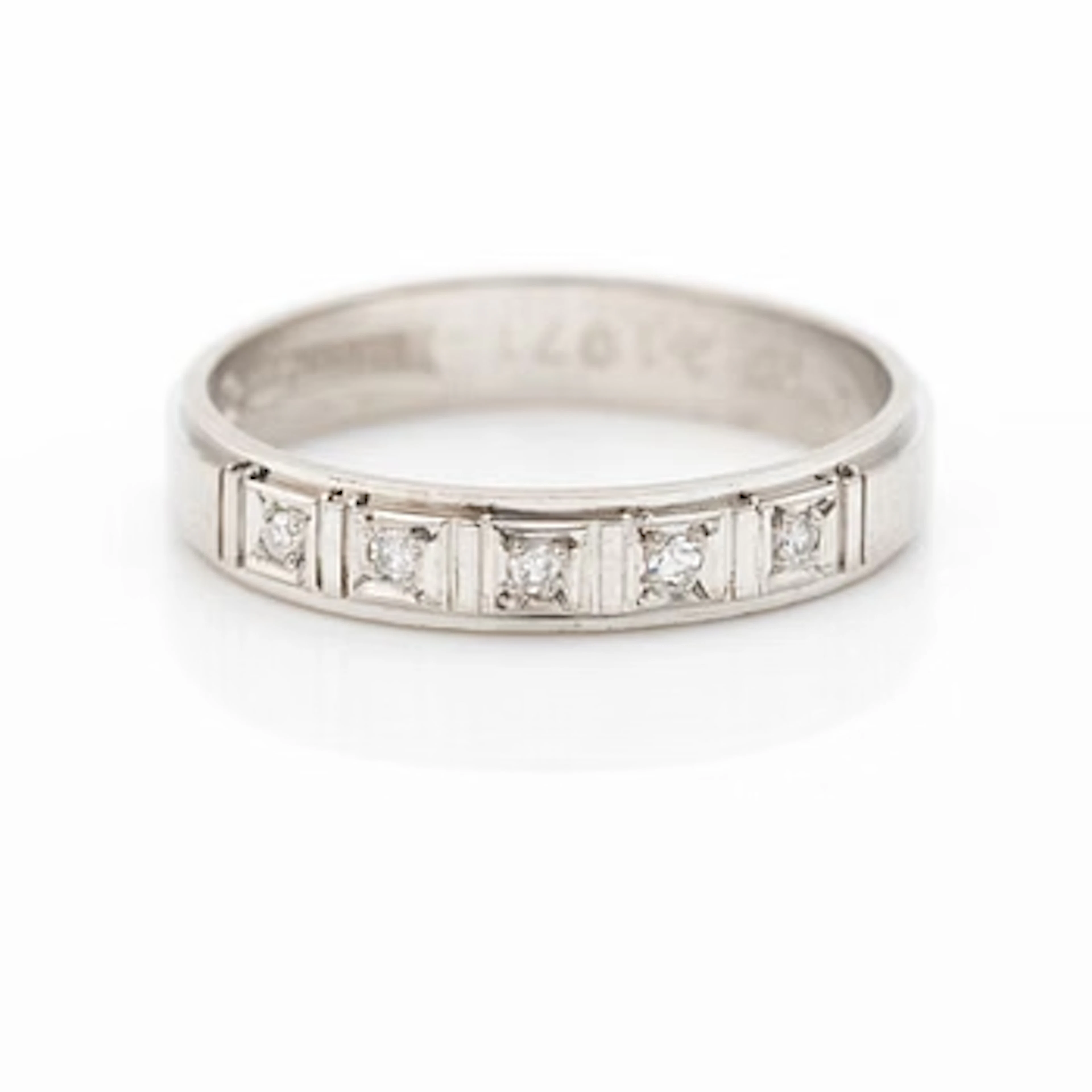 Half-eternity ring, 18K white gold with octagonal-cut diamonds.