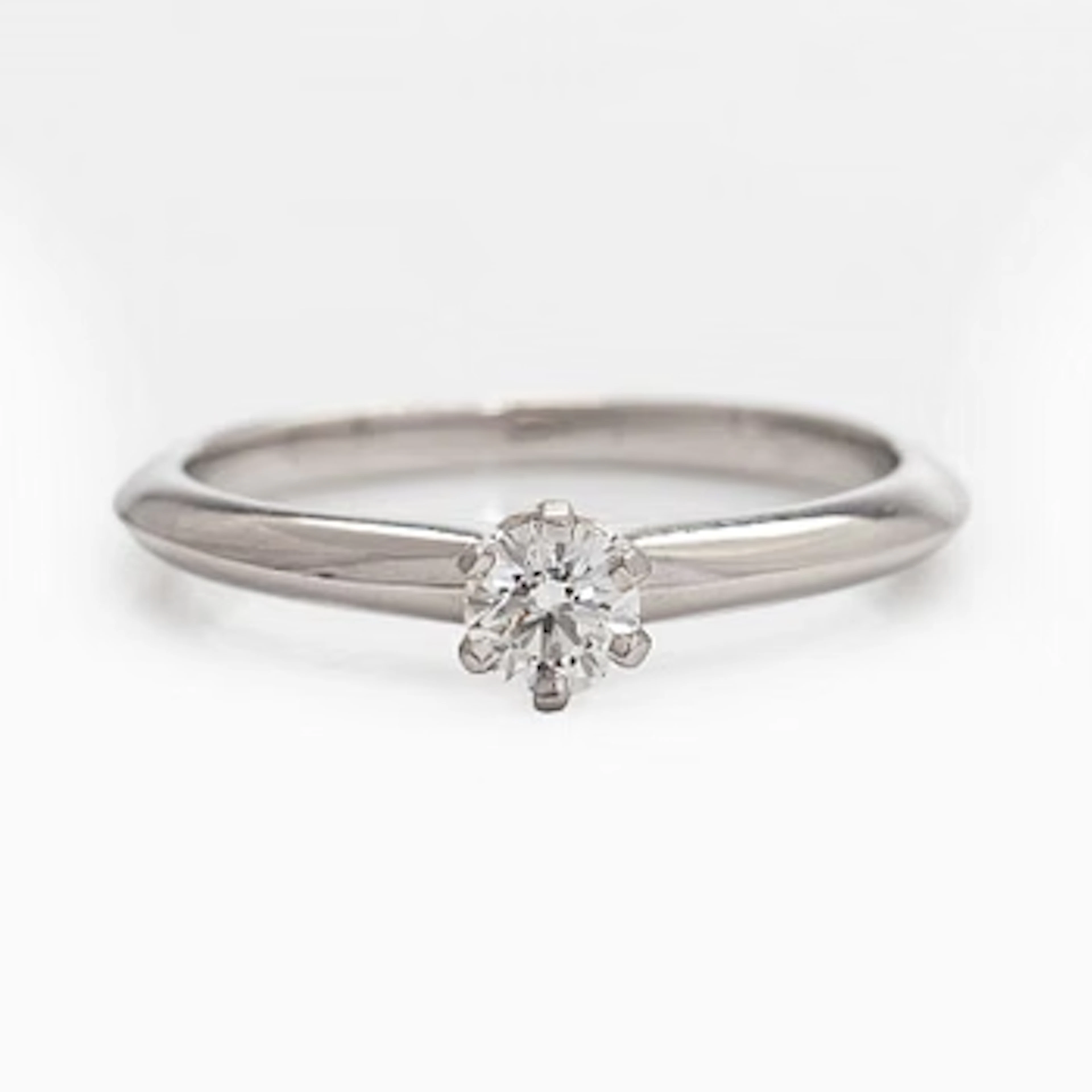 Tiffany & Co, a platinum solitaire ring with a brilliant-cut diamond.