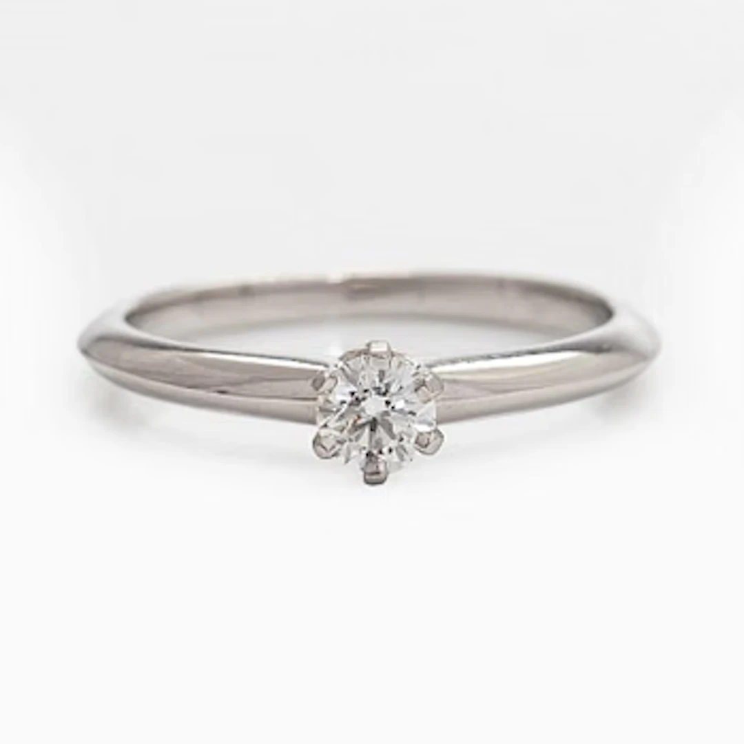 Tiffany & Co, a platinum solitaire ring with a brilliant-cut diamond.
