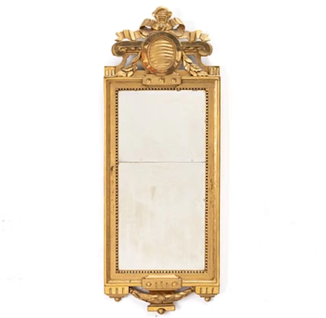 A Gustavian giltwood mirror, Stockholm, late 18th century.
