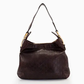 Gucci, a leather shoulder bag.