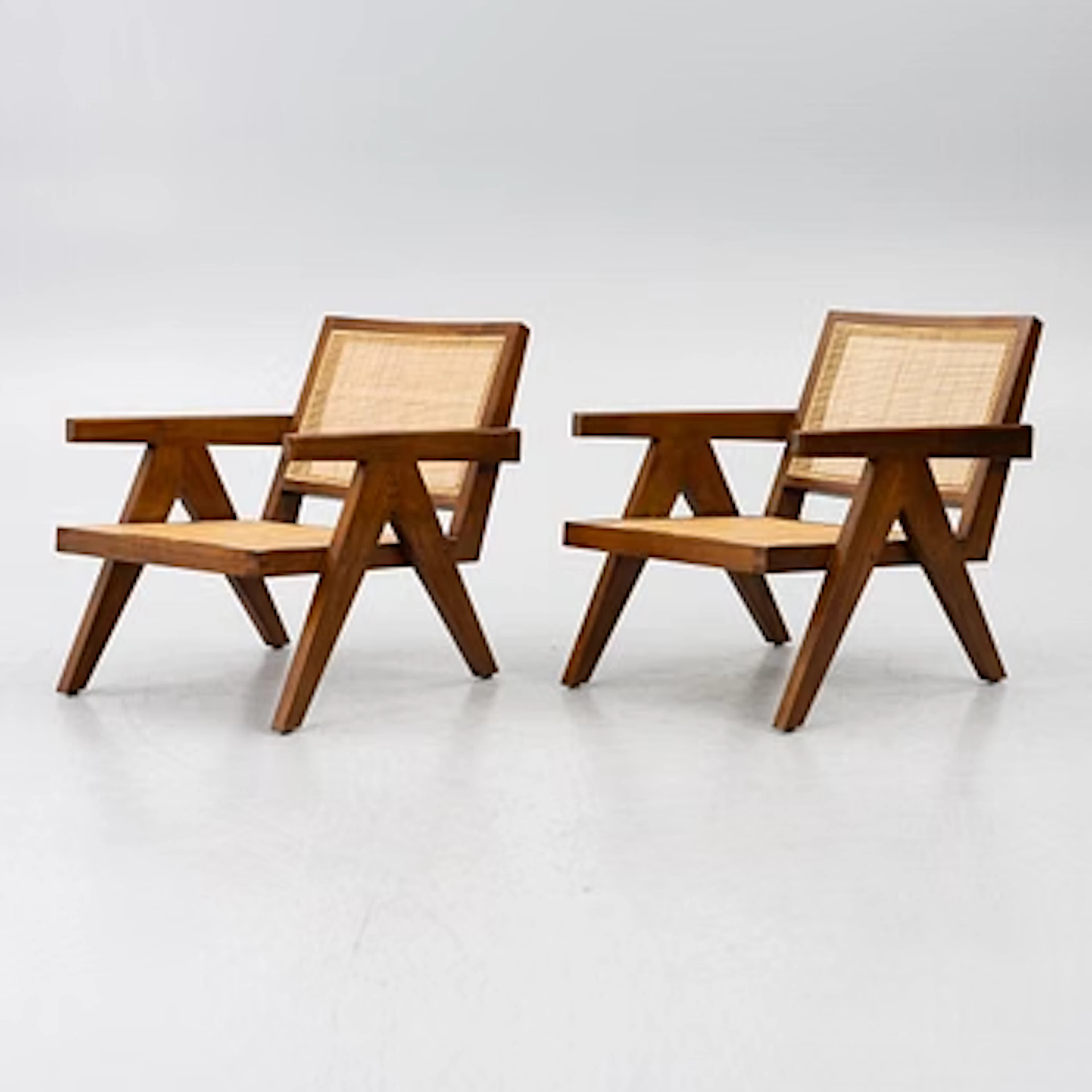 A pair of Aristide armchairs by Eichholtz.