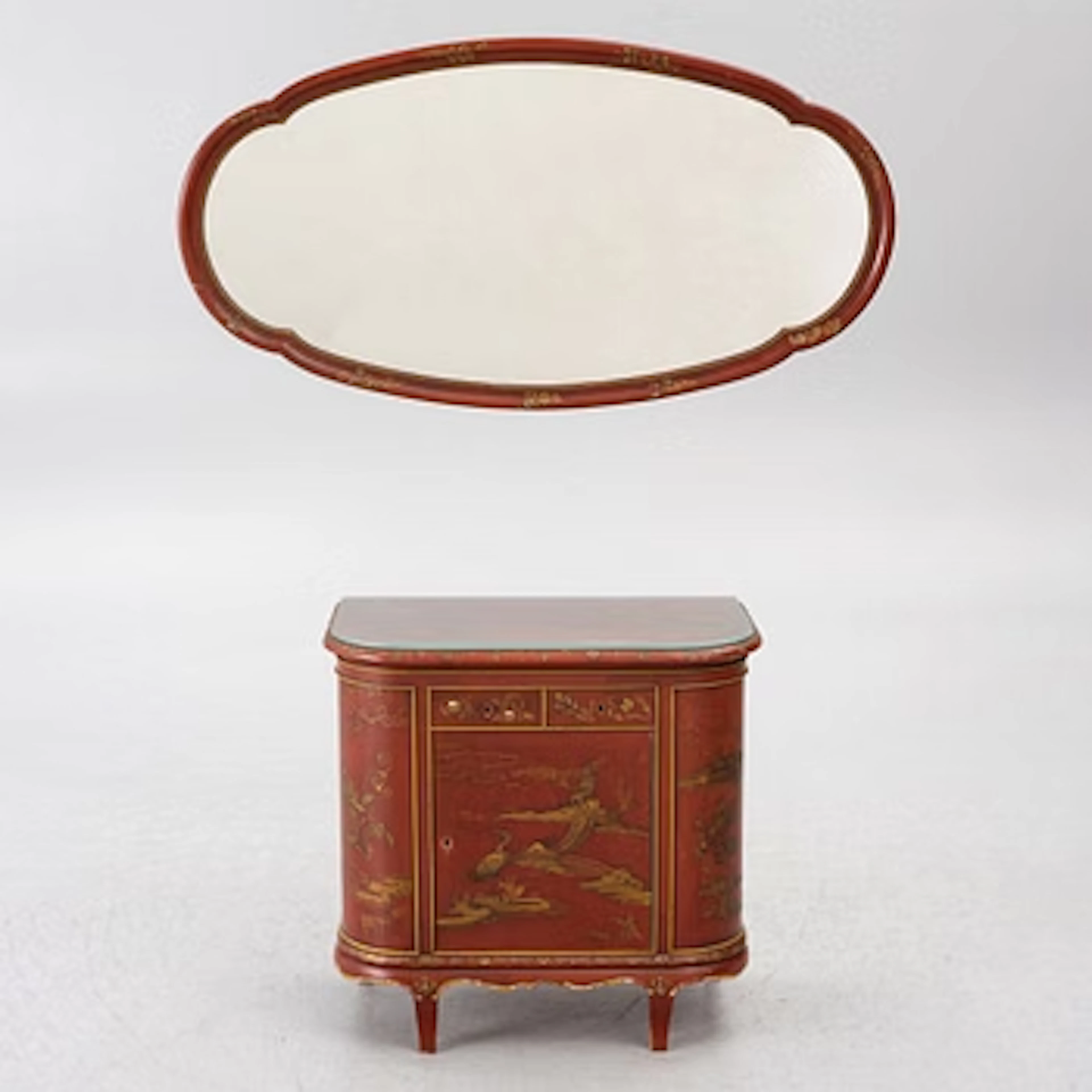 A mirror and chest of drawers, 20th Century.