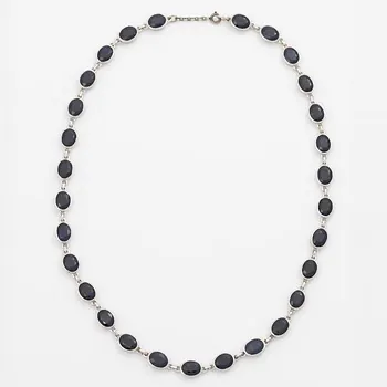 18K white gold necklace with dark sapphires.