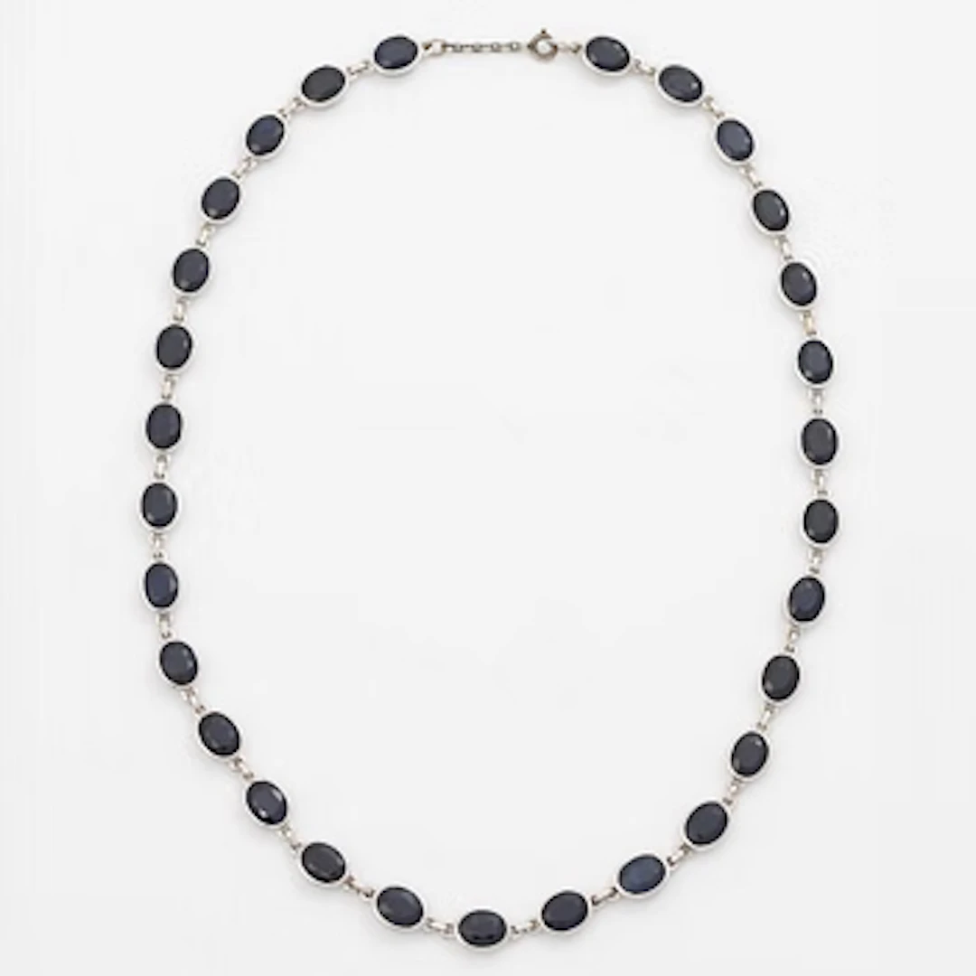 18K white gold necklace with dark sapphires.
