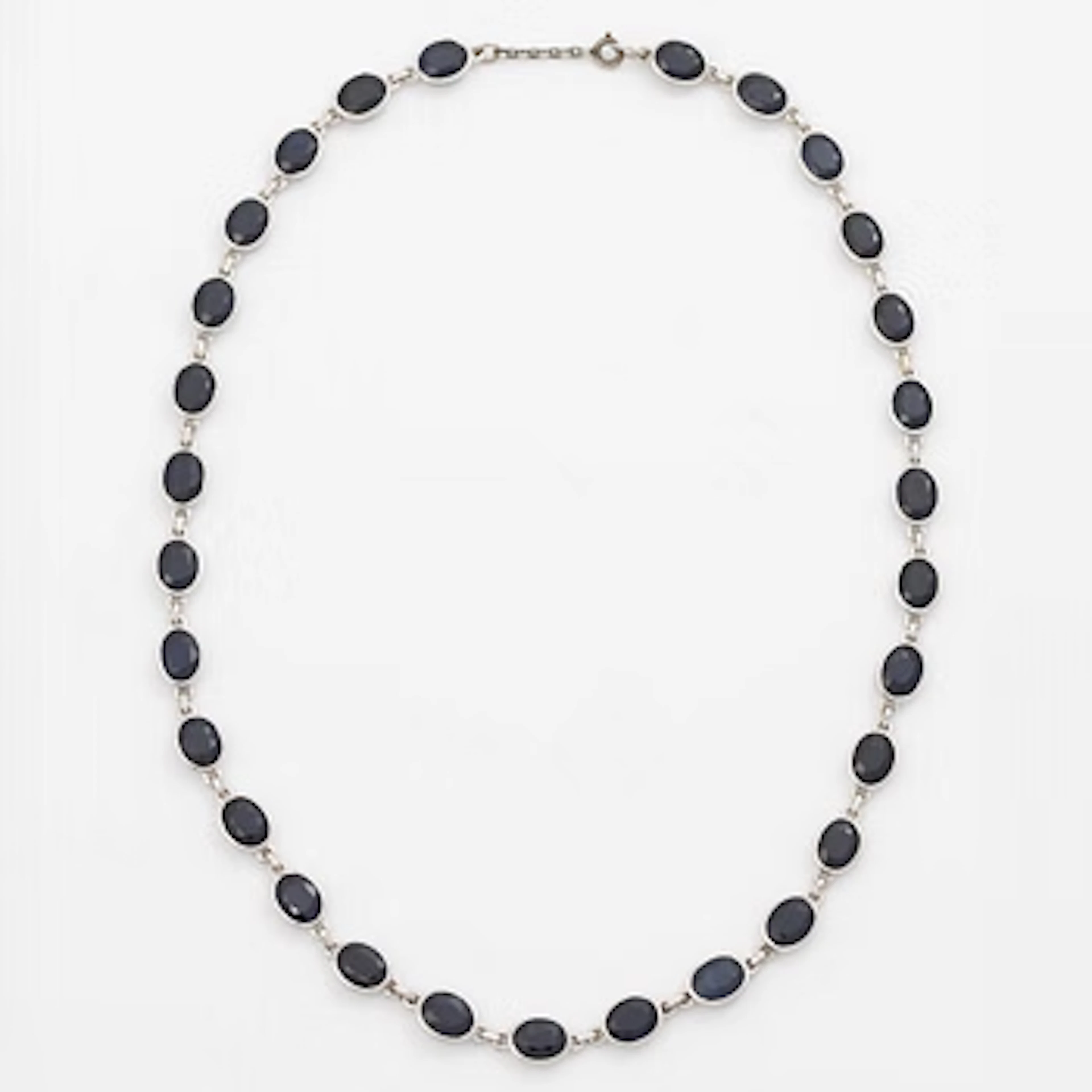 18K white gold necklace with dark sapphires.
