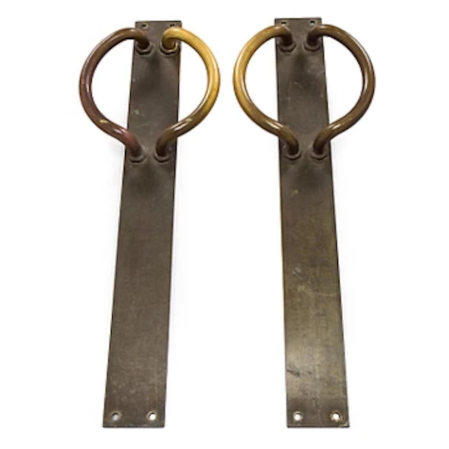 A pair of mid-20th century door handles.