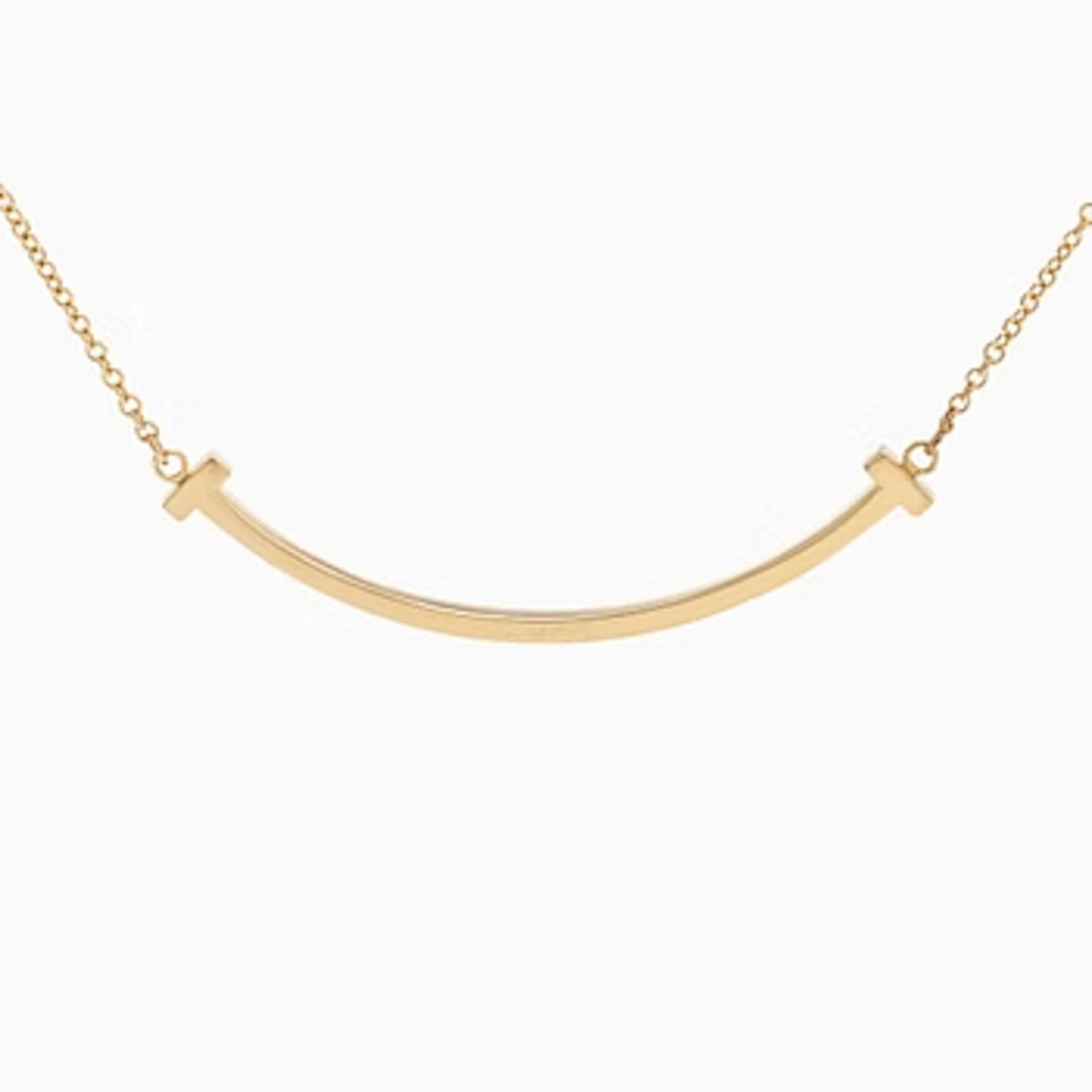Tiffany & Co, an 18K gold 'T Smile' necklace.