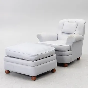 Josef Frank, a model 336 armchair with ottoman, Firma Svenskt Tenn, Sweden.