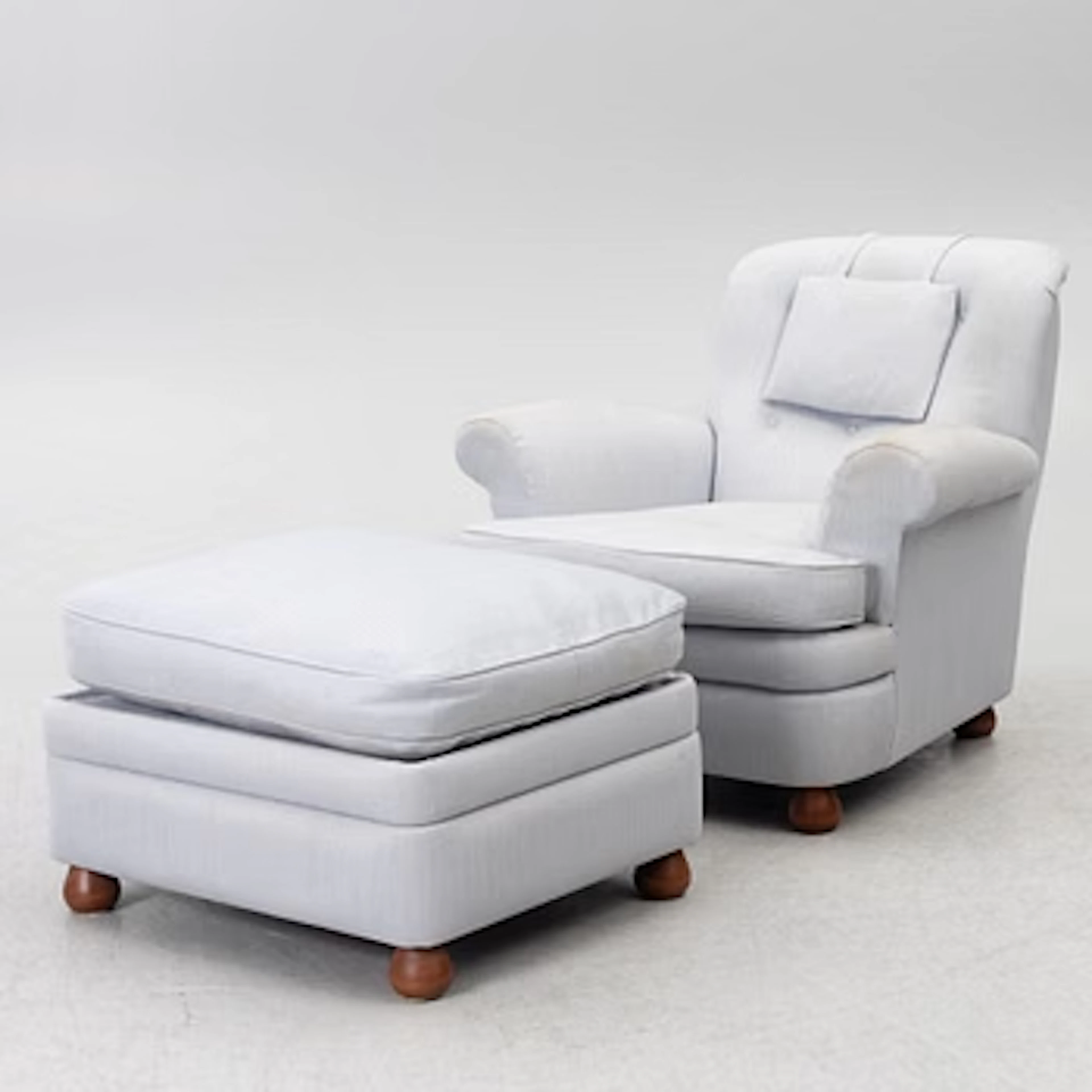 Josef Frank, a model 336 armchair with ottoman, Firma Svenskt Tenn, Sweden.