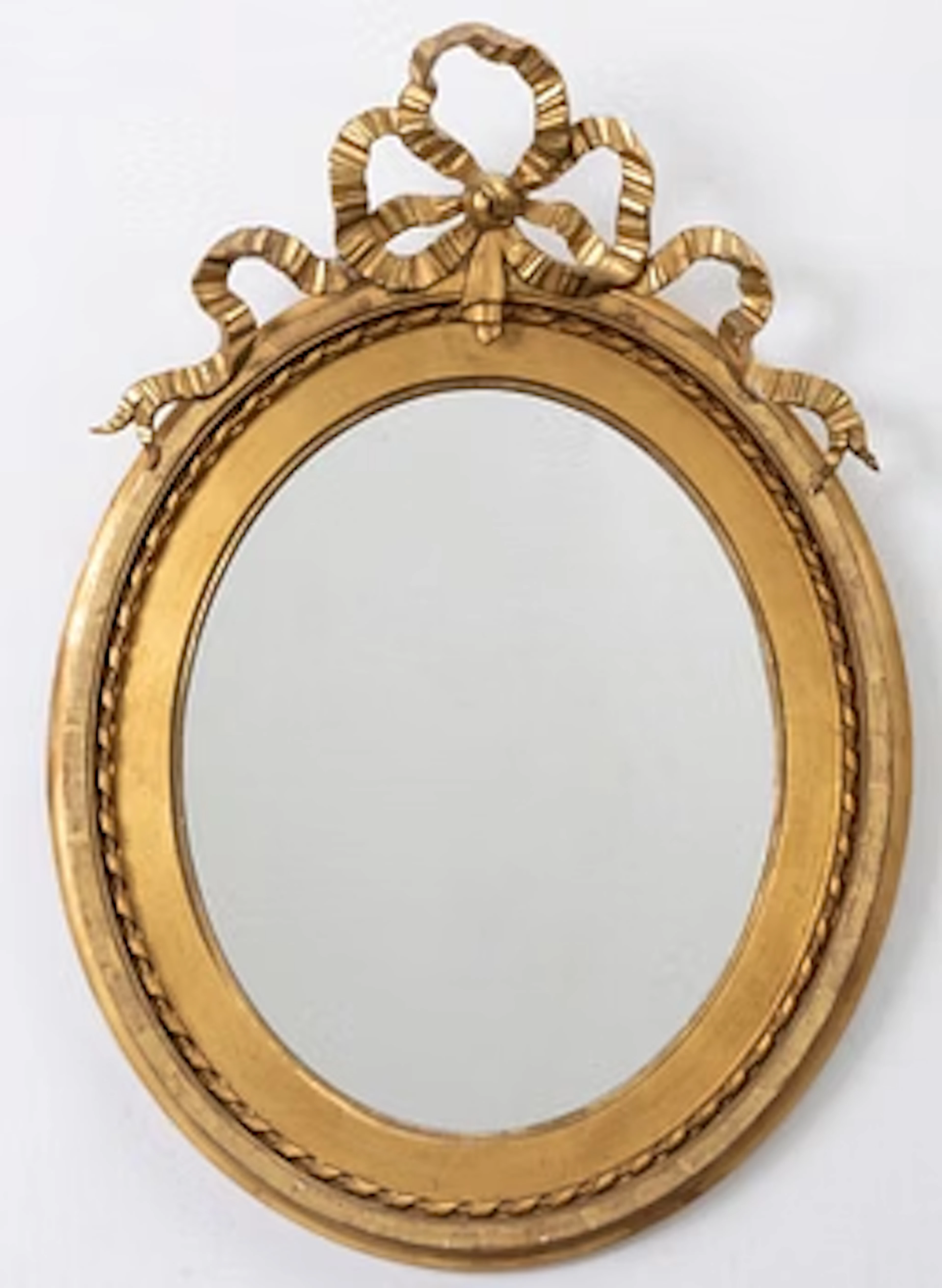 A Gustavian style mirror, early 20th Century.
