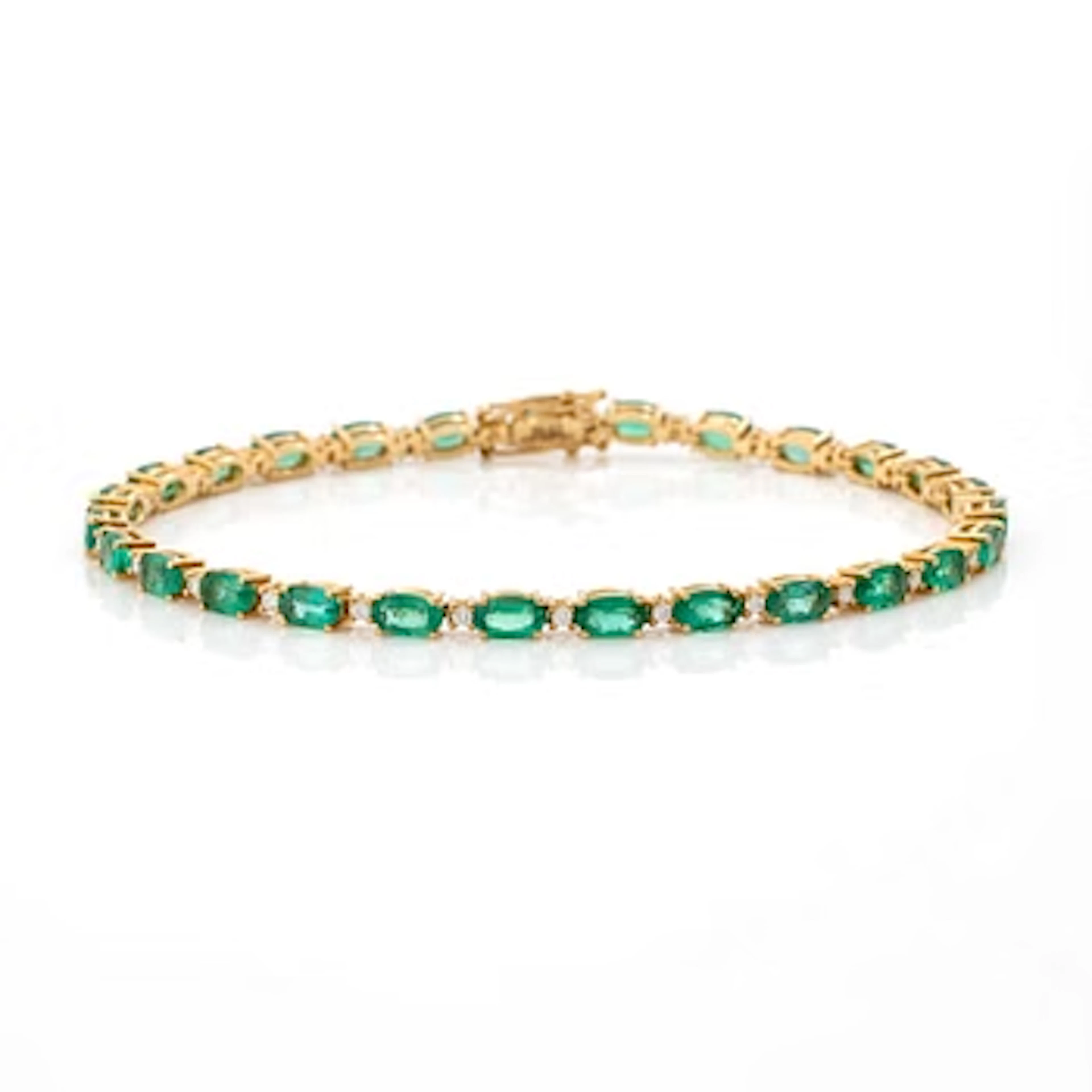 Bracelet 18K gold with emeralds and brilliant-cut diamonds.