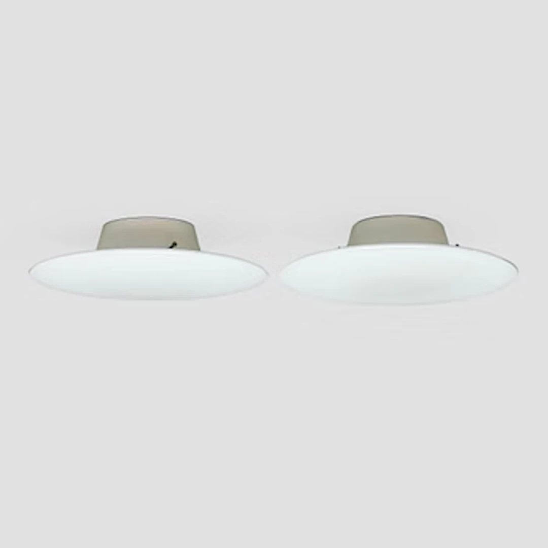 Arne Jacobsen, a pair of 1960's 'AJ-Eklipta' ceiling/wall lamps, for