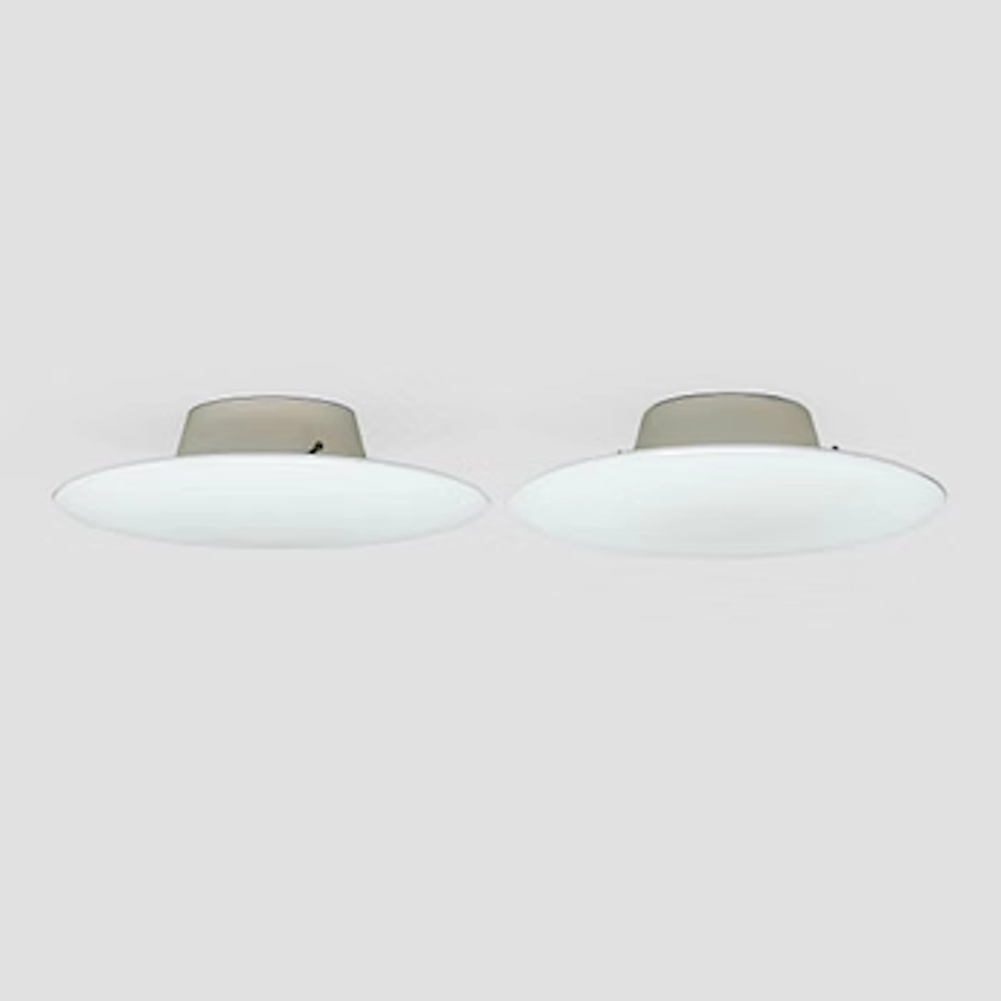 Arne Jacobsen, a pair of 1960's 'AJ-Eklipta' ceiling/wall lamps, for