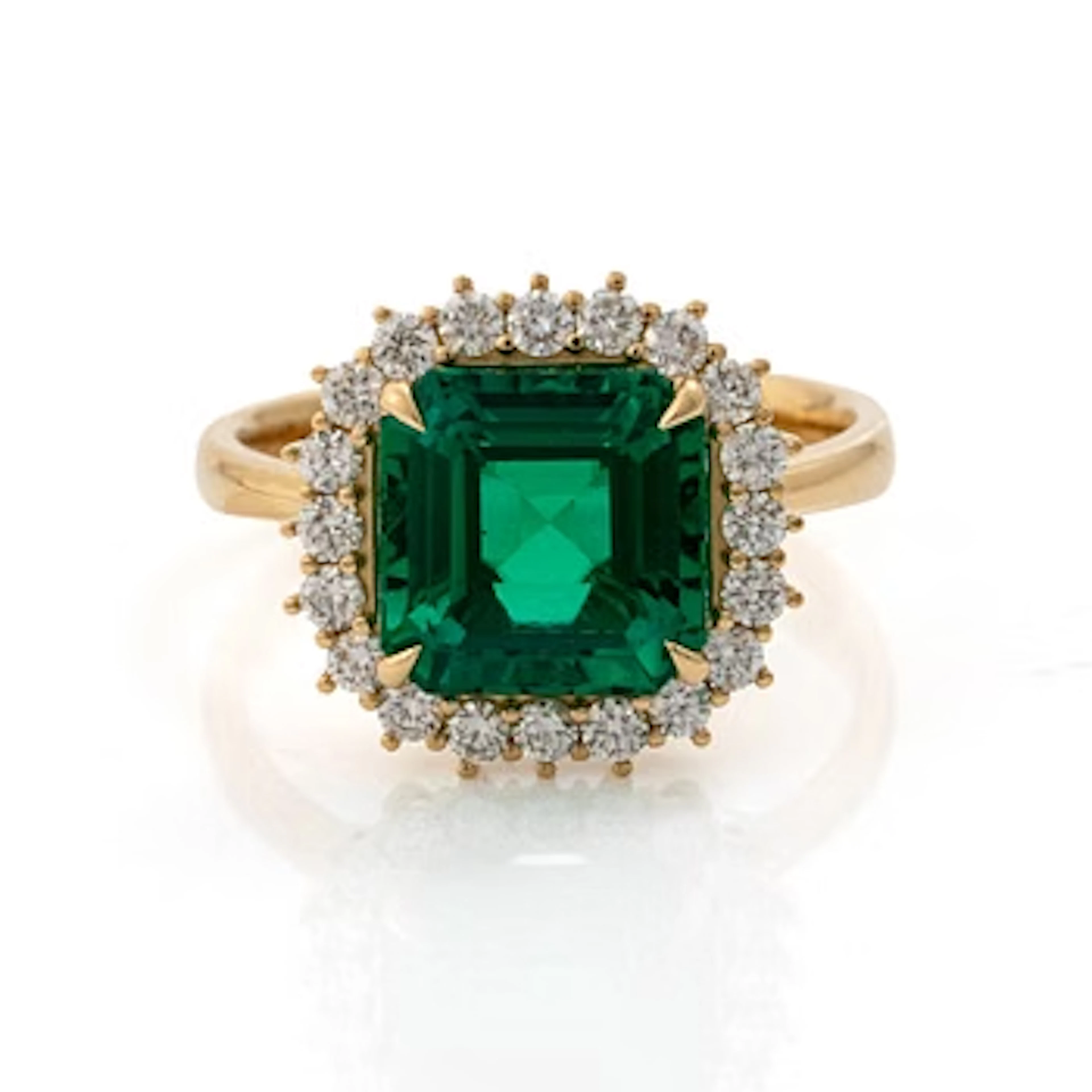 Ring 18K gold with synthetic emerald and brilliant-cut diamonds.