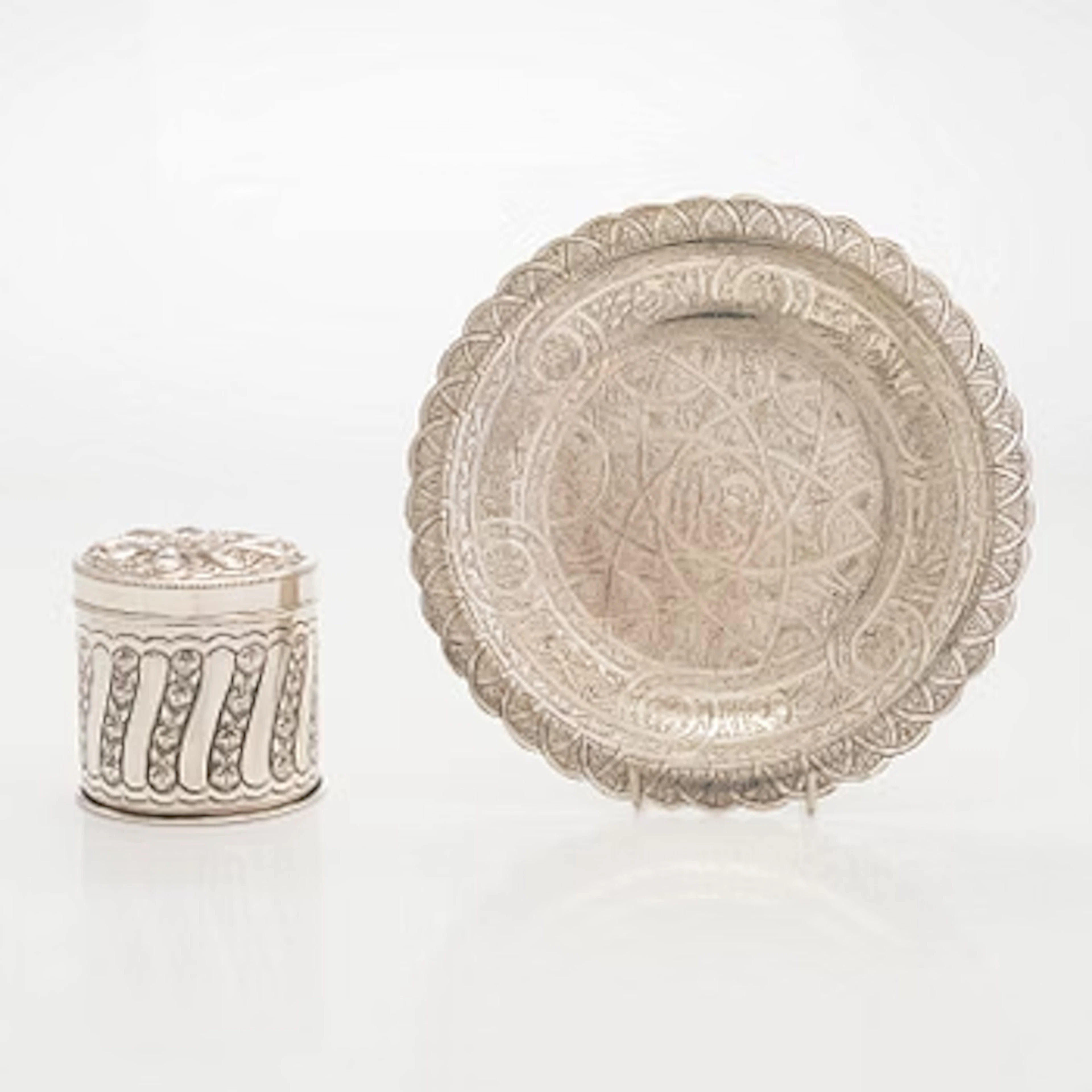 A silver plate and lidded jar, Egypt mid-20th century.