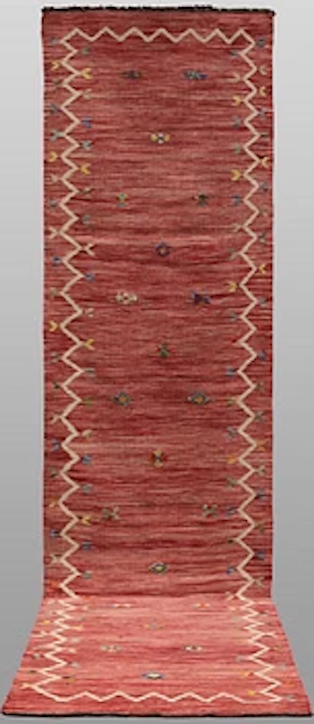 A Kelim runner carpet, 296 x 84 cm.