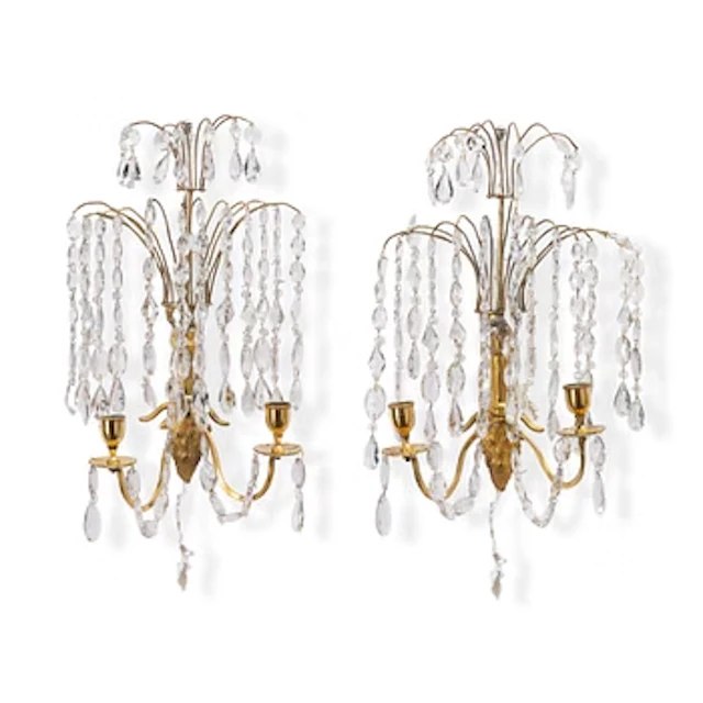 A pair of late Gustavian ormolu two-branch lustres, circa 1800.