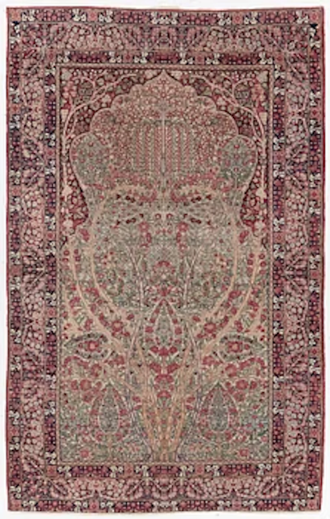 An antique Kirman rug, south Persia, c. 220 x 140 cm.