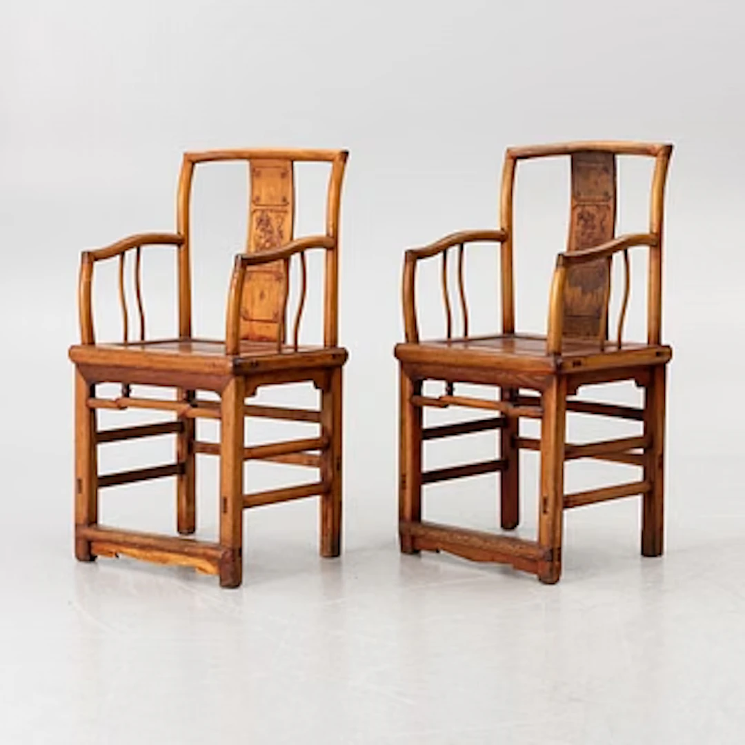 A pair of Chinese hardwood armchairs, 20th century.
