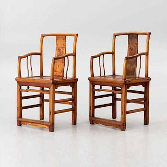 A pair of Chinese hardwood armchairs, 20th century.