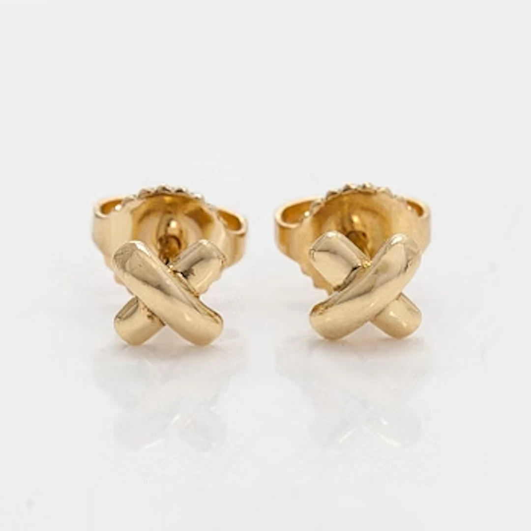 Tiffany & Co, a pair of 18K gold "Cross Stitch" earrings.
