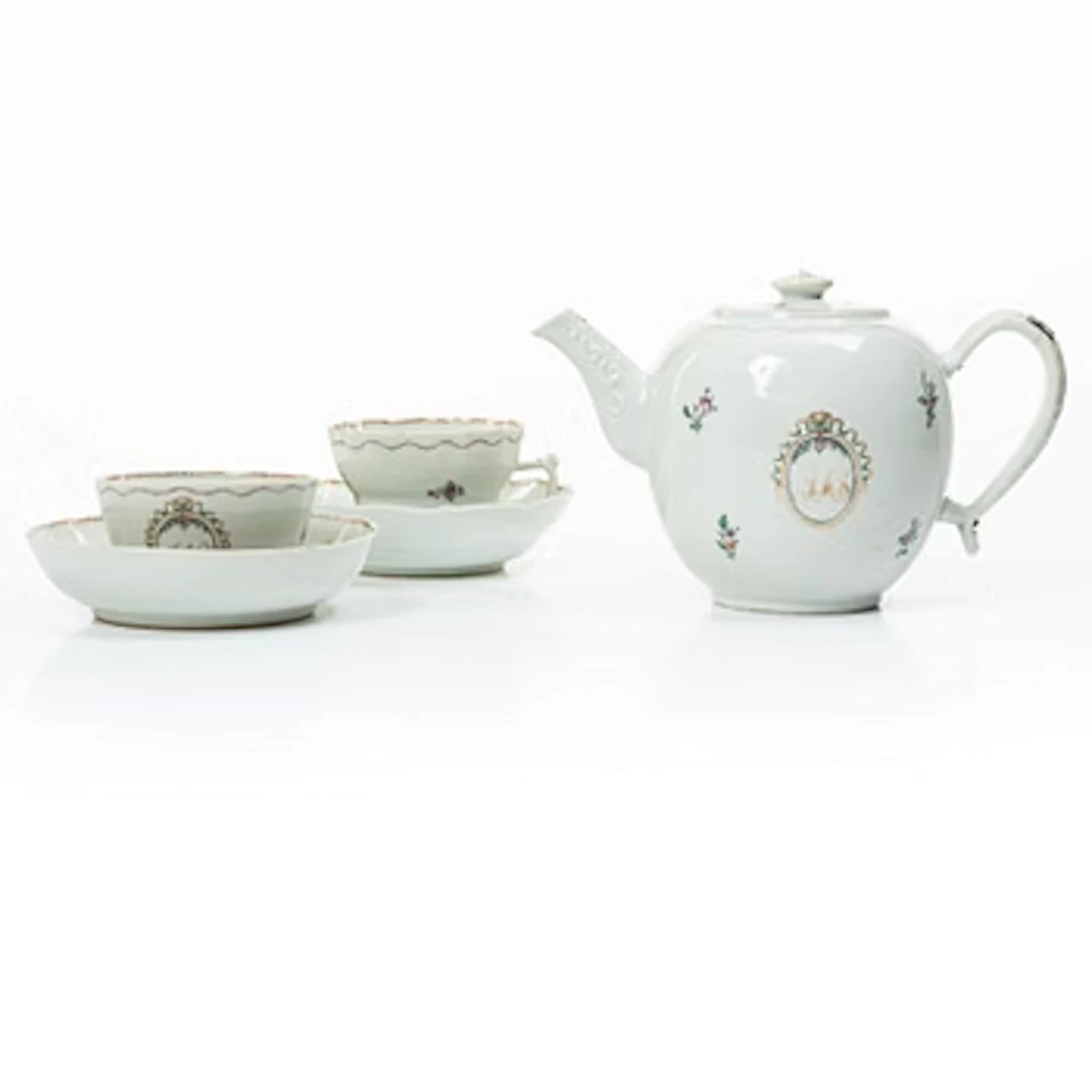 Cups and saucers, 11+7, and a teapot in famille rose with monogram