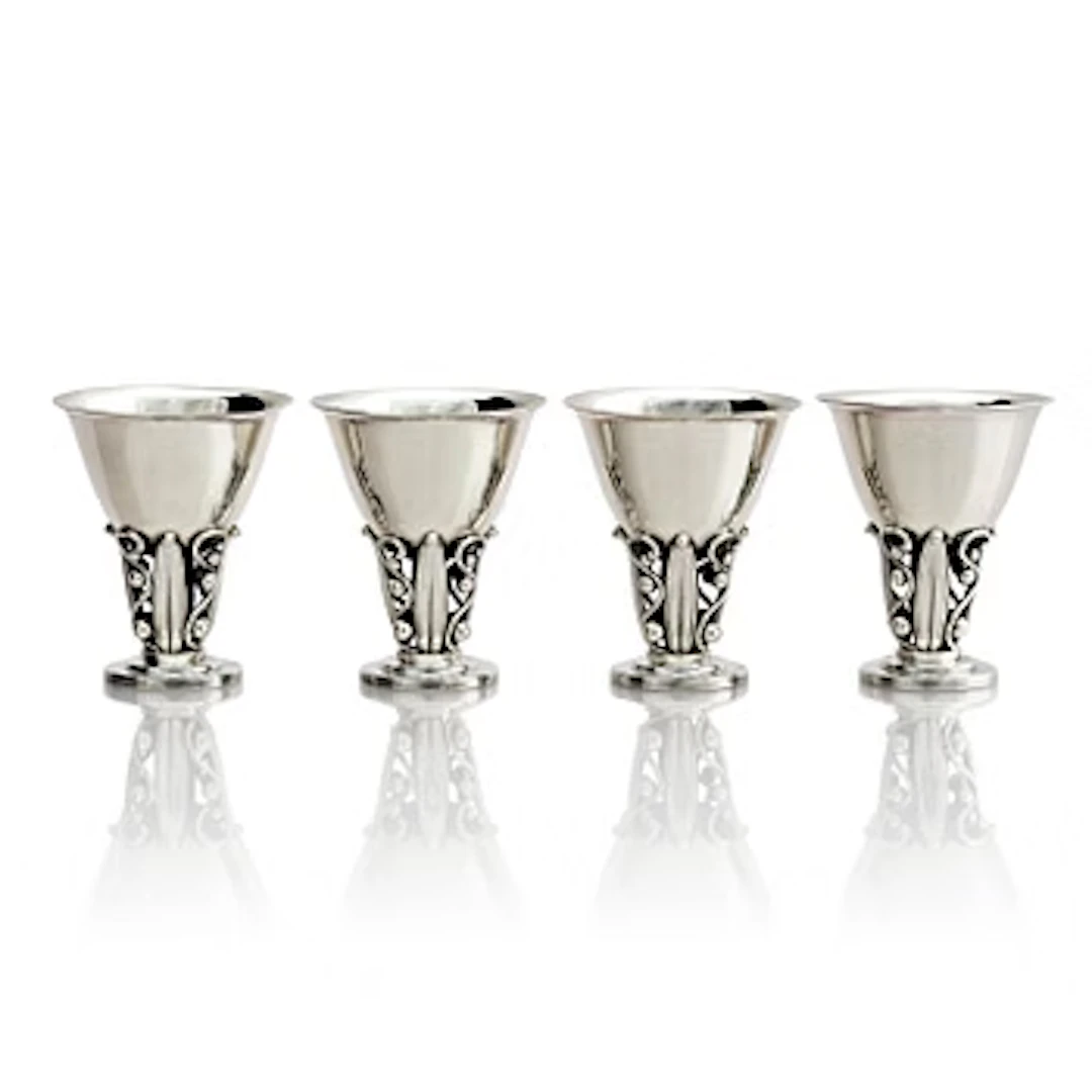 Evald Nielsen, four sterling silver beakers/cups on a foot, Denmark