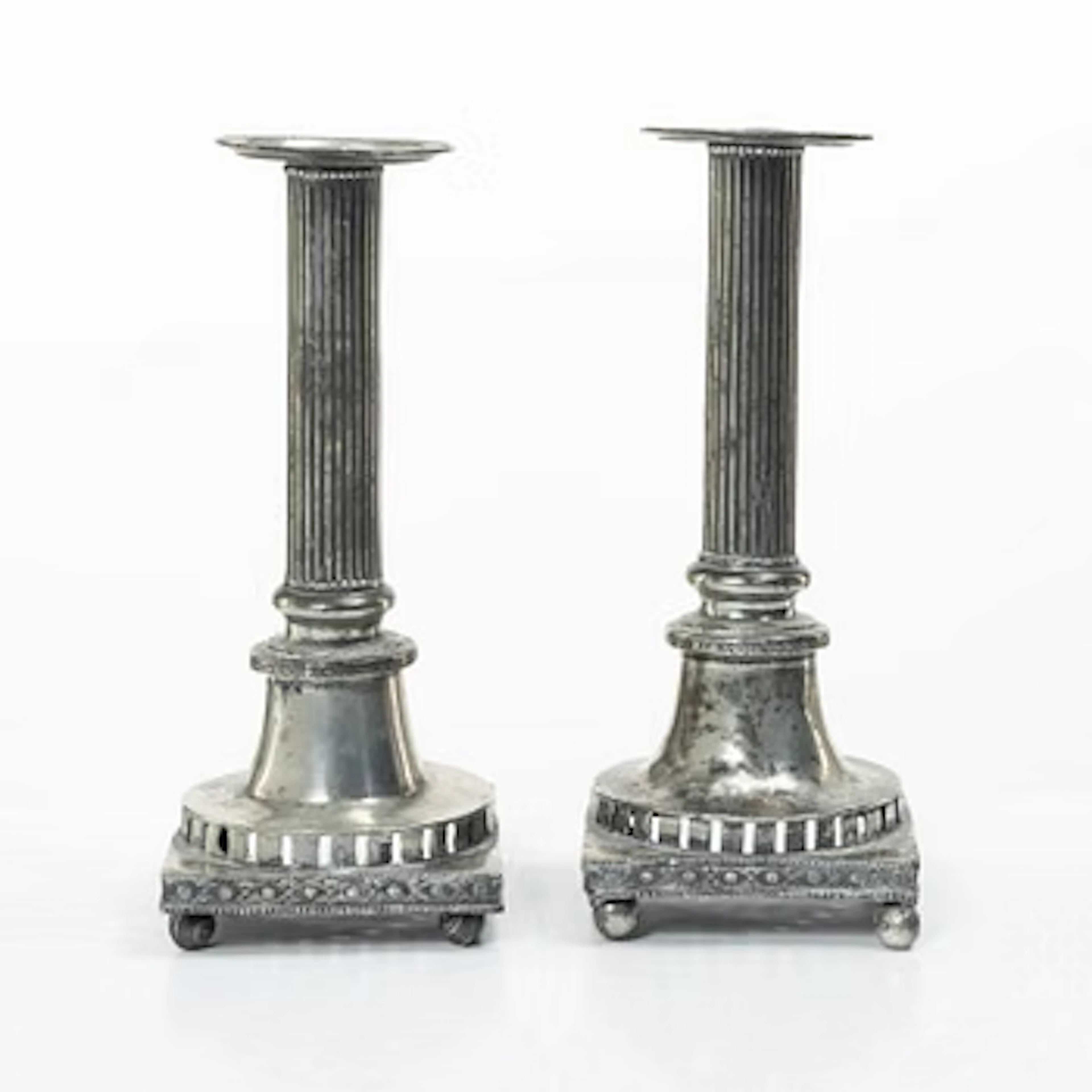 A pair of peuter candlesticks by Hans Wicksten (active between 1782-1810)