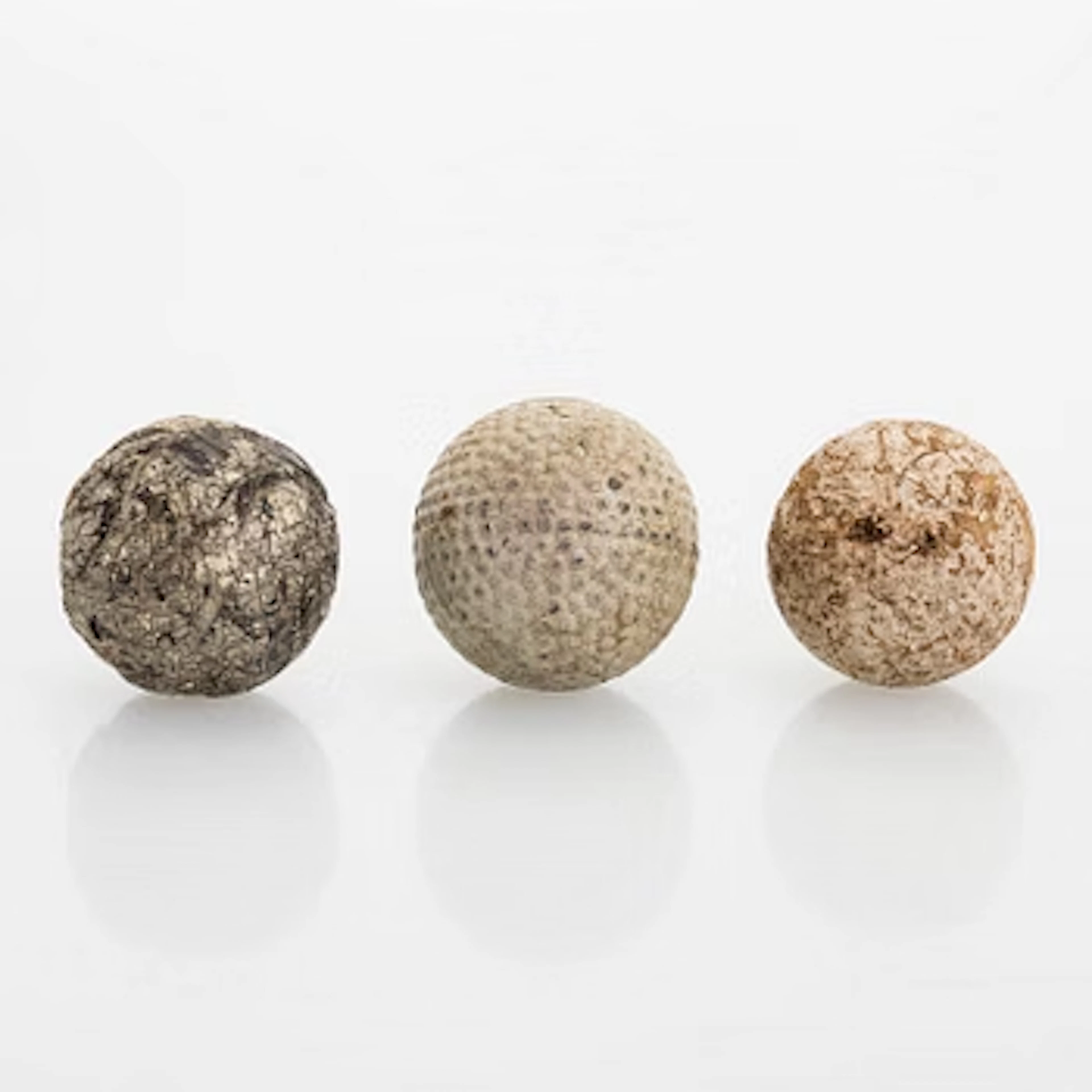 Golf balls, 3 pcs, turn of the 20th century.