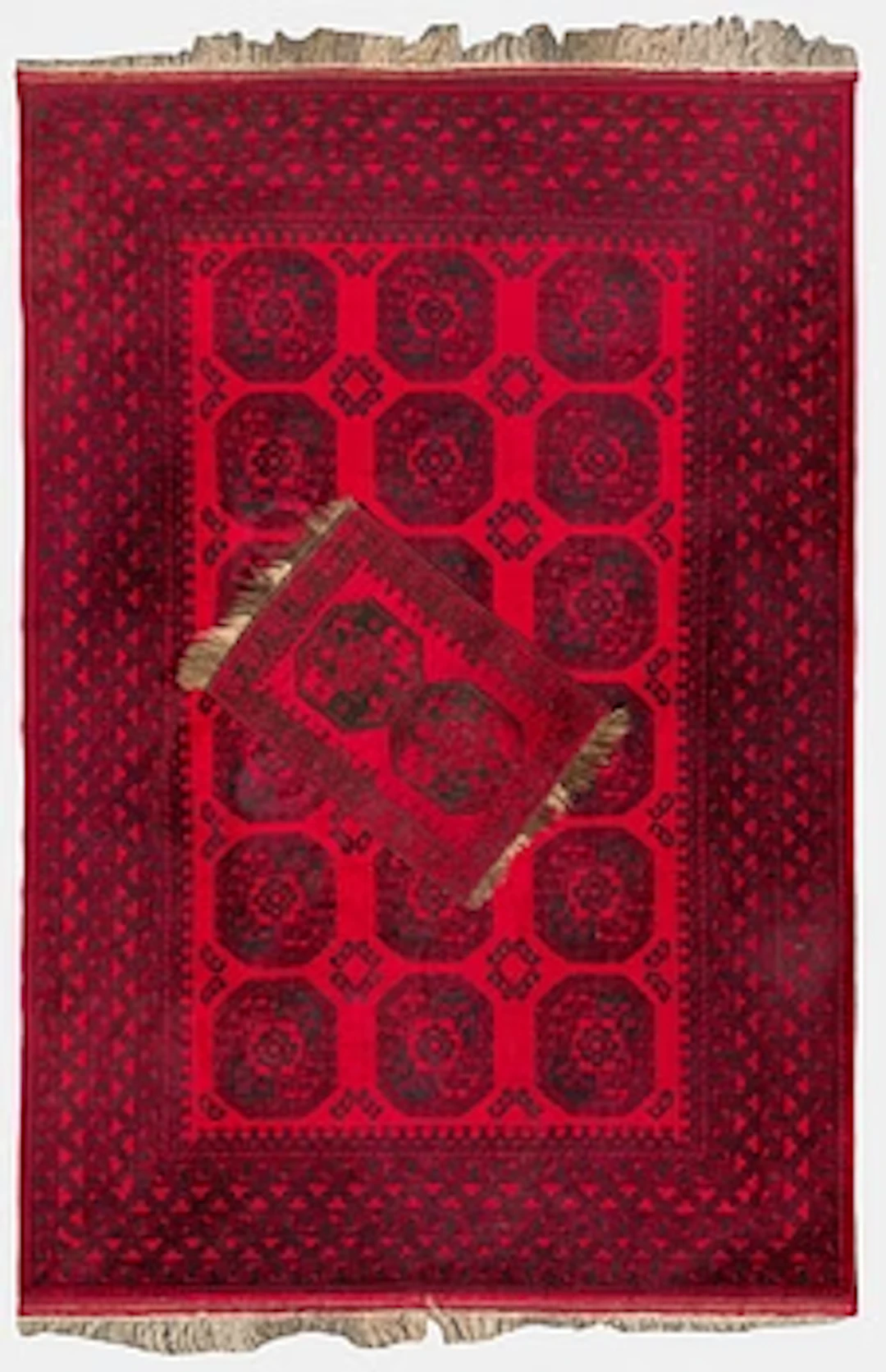 Two Afghan carpets. Ca. 326 x 217 and 88 x 63 cm.