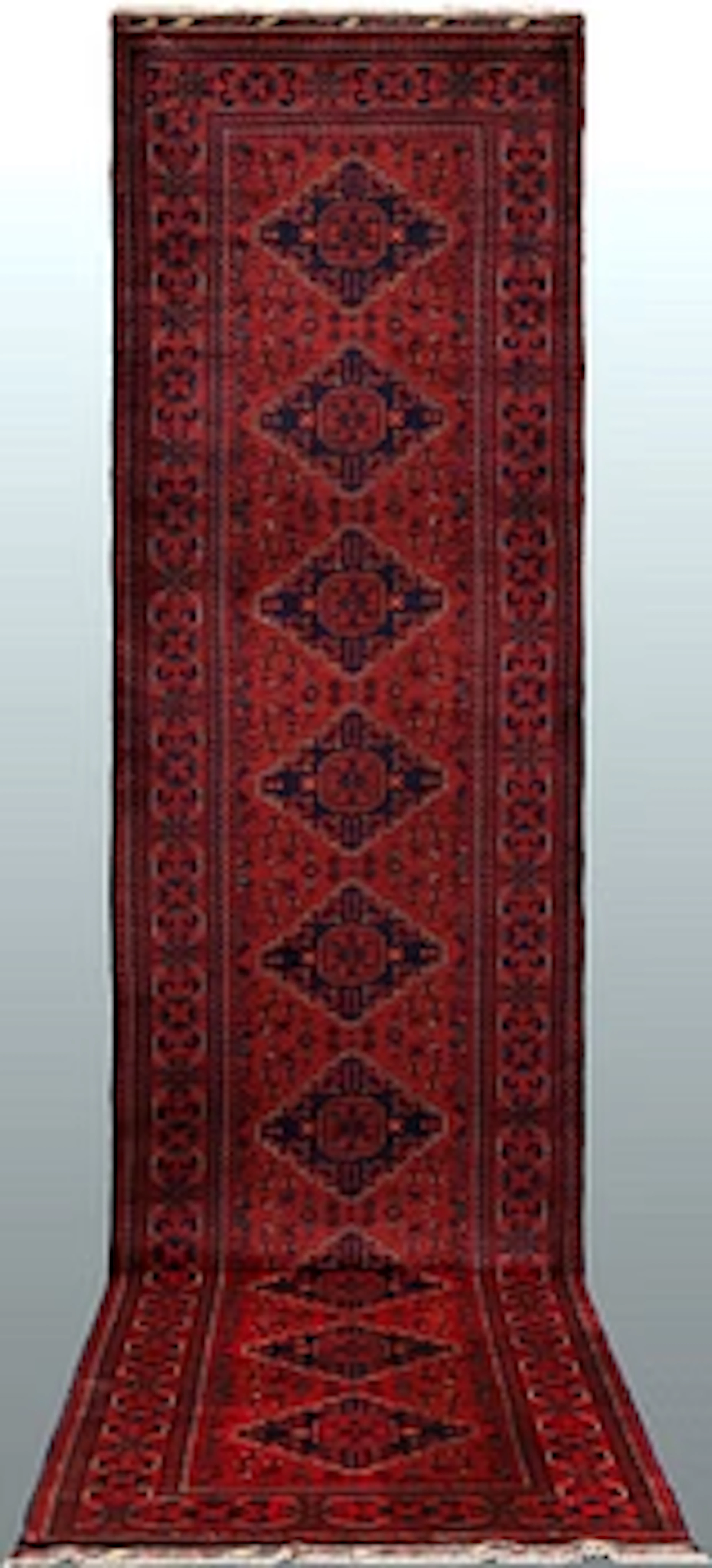 An Afghan runner carpet, 391 x 87 cm.