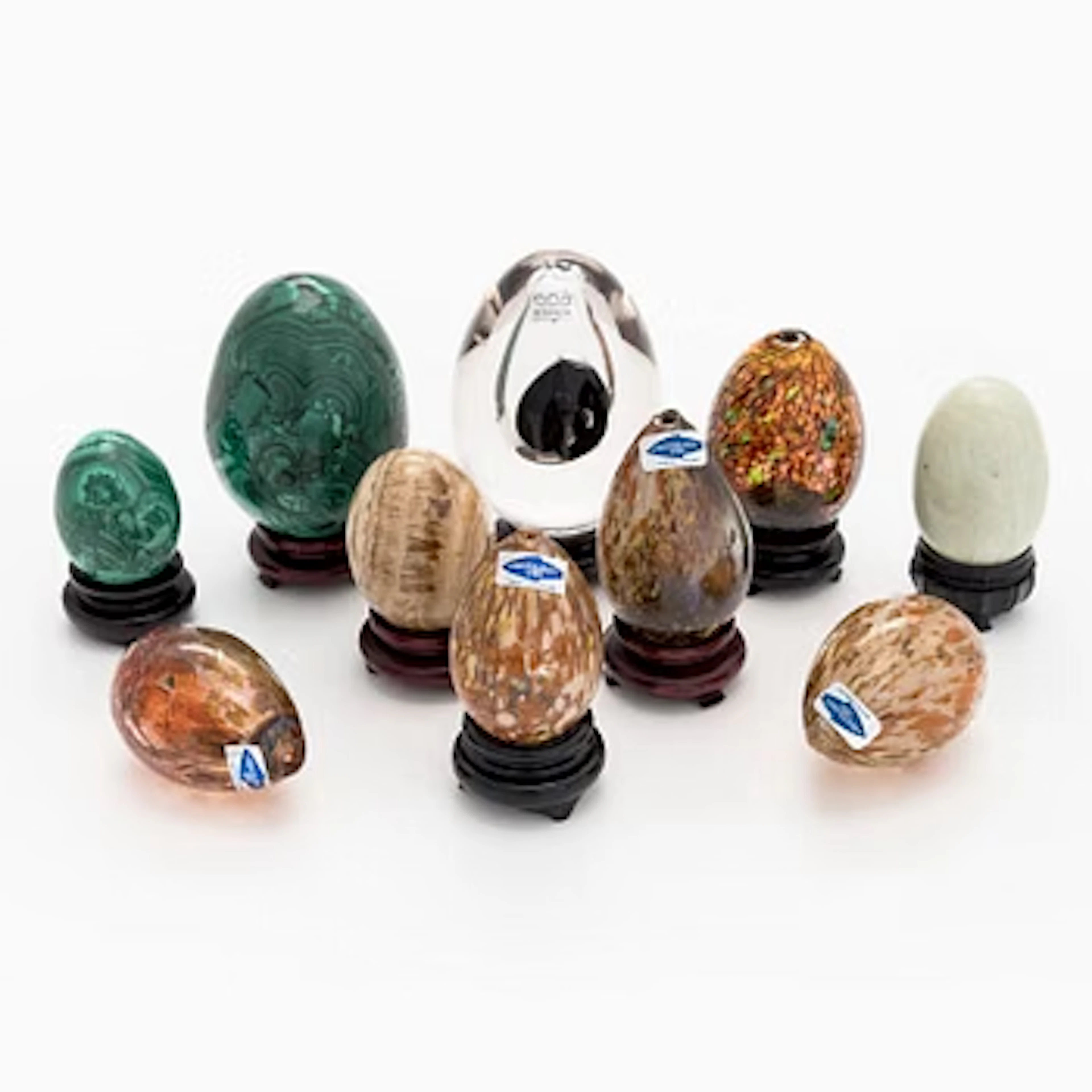 A set of 10 glass and stone decorative eggs.